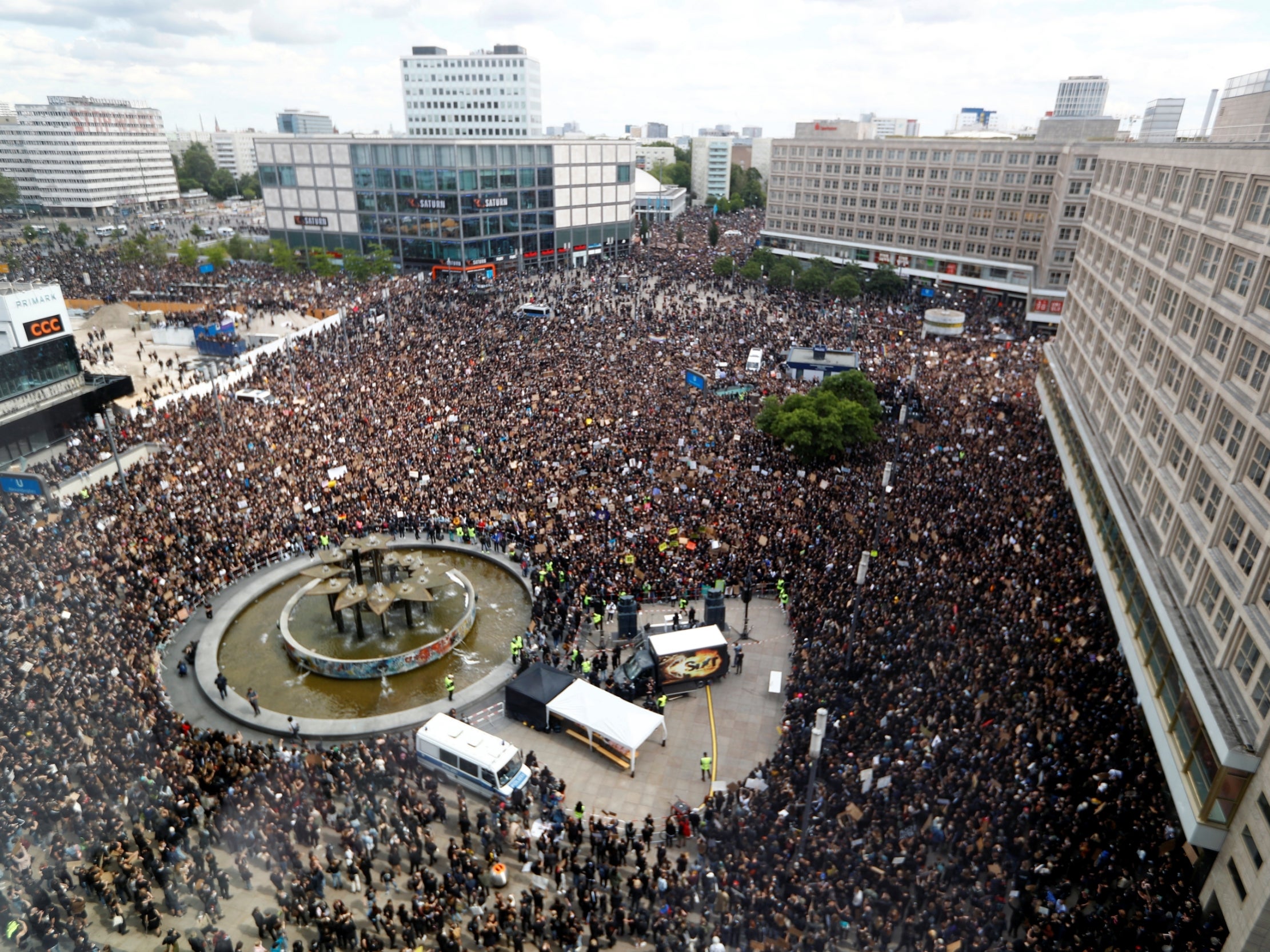 Demonstrators attend a protest at Alexanderplatz in Berlin