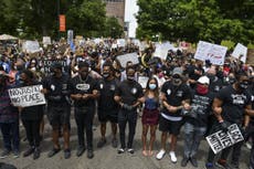 Broncos join protest in Denver after coach apologises for NFL comment