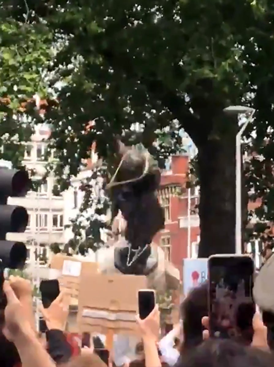 Protesters pulling down a statue of slave trader Edward Colston