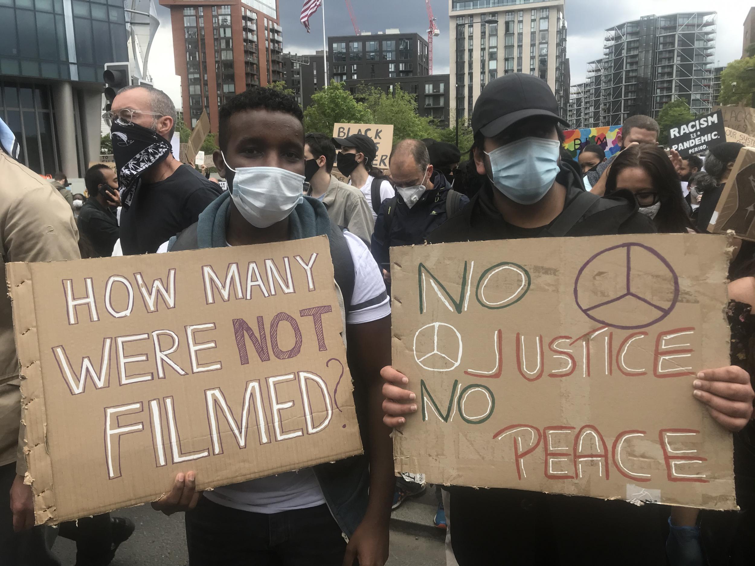 Anis (left), pictured at the protest with his friend Irav