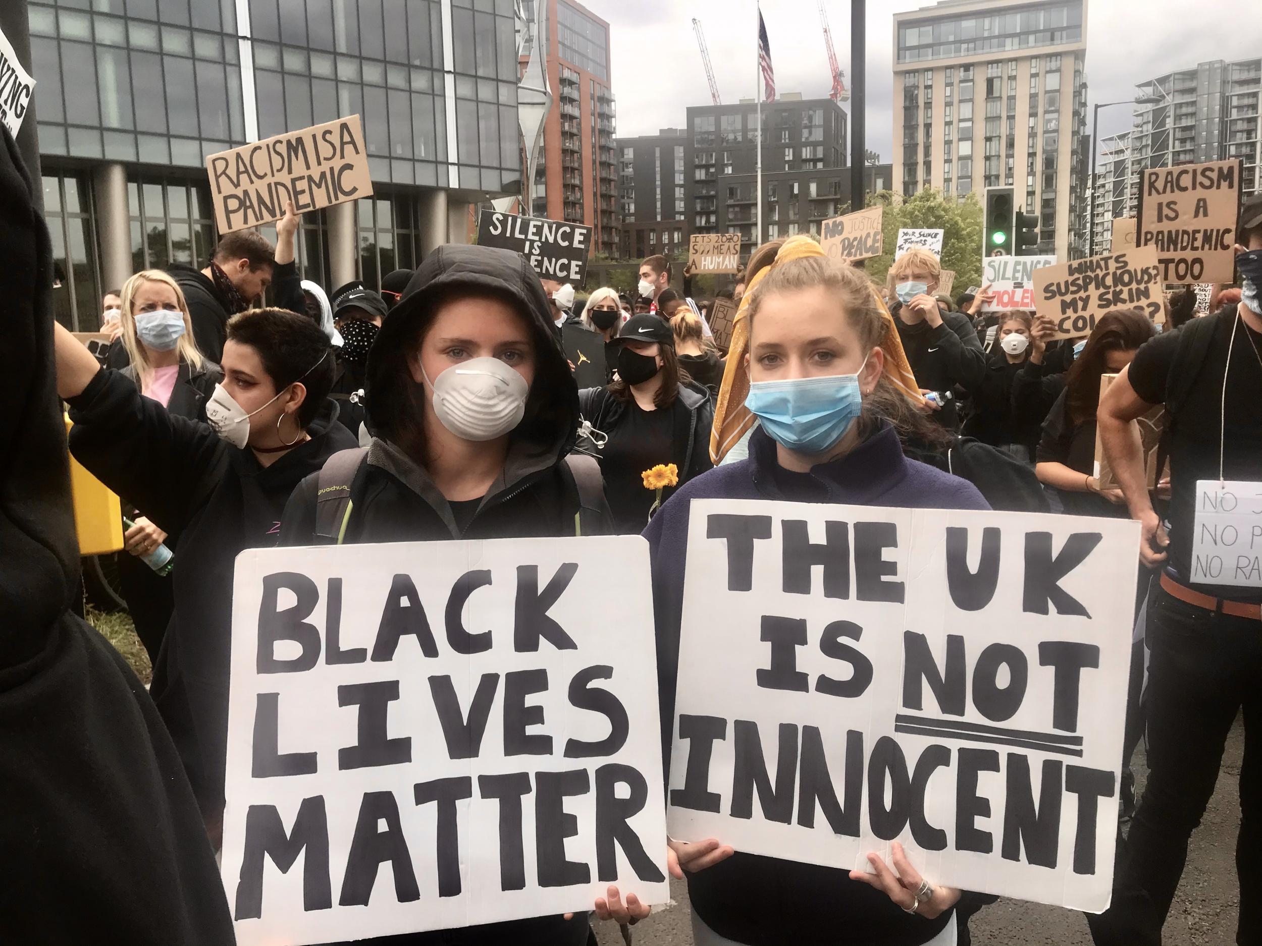 Beatrice (left) and her sister Eloise (right) travelled from Surrey to take part in the protest