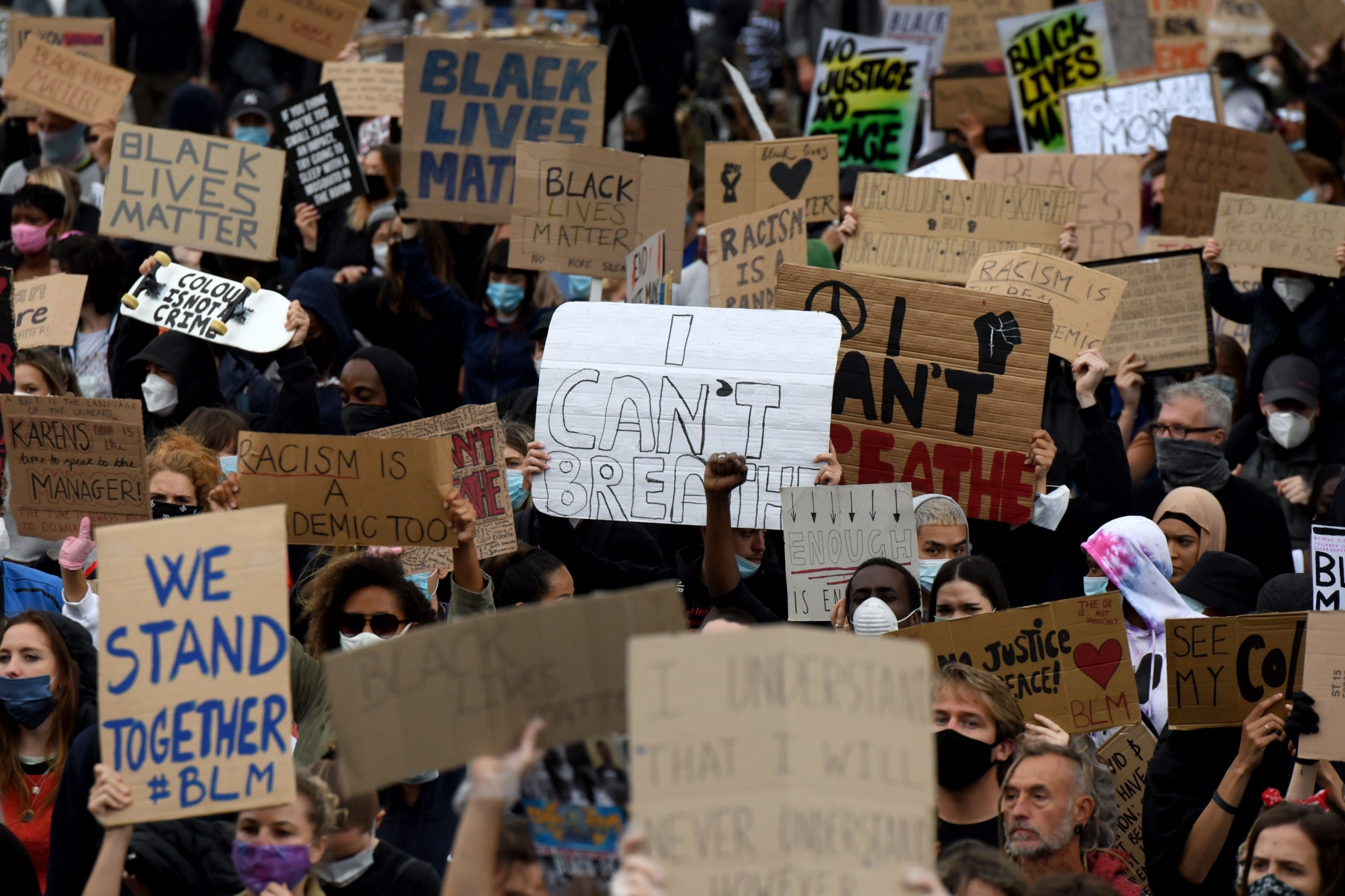 &#13;
Black Lives Matter protesters gather outside the US embassy in London on Sunday &#13;