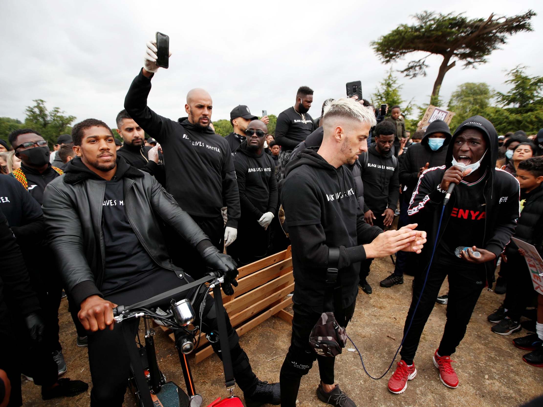 Anthony Joshua was seen on crutches and a mobility scooter due to a knee injury