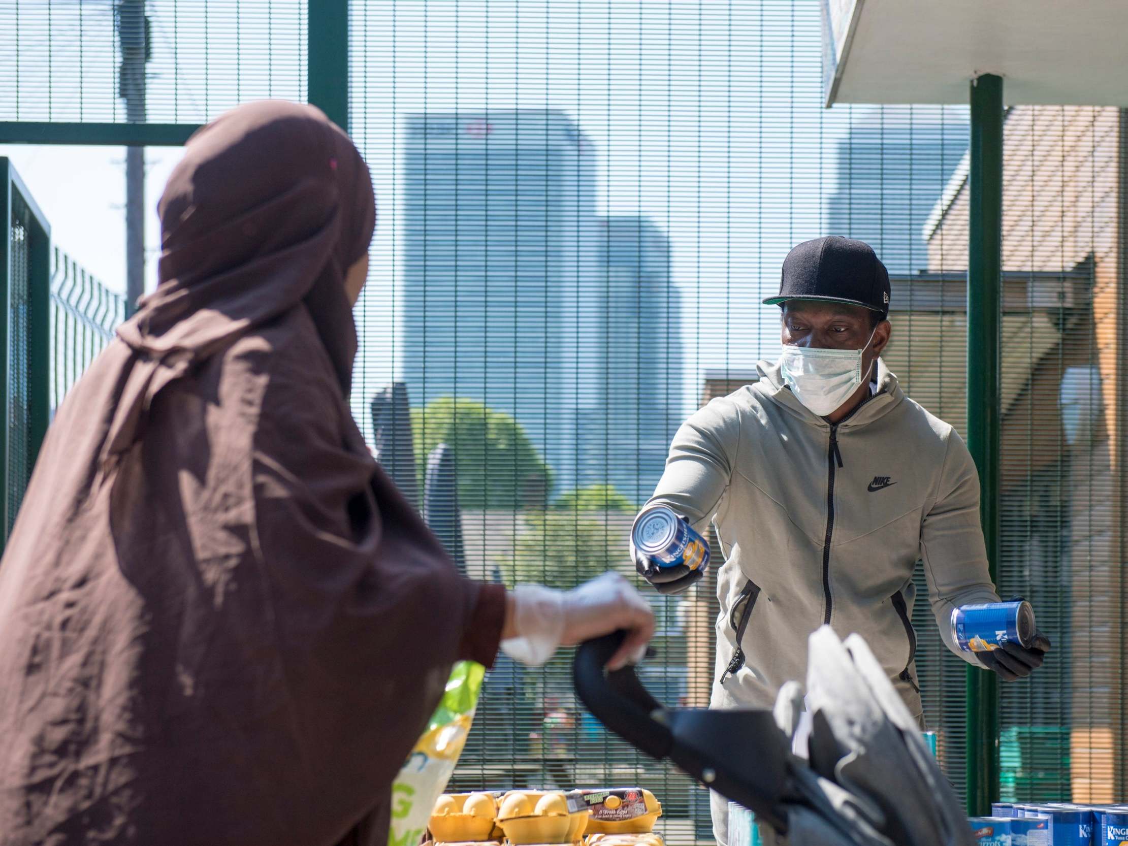 Dizzee Rascal hands out food to families at a Poplar primary school