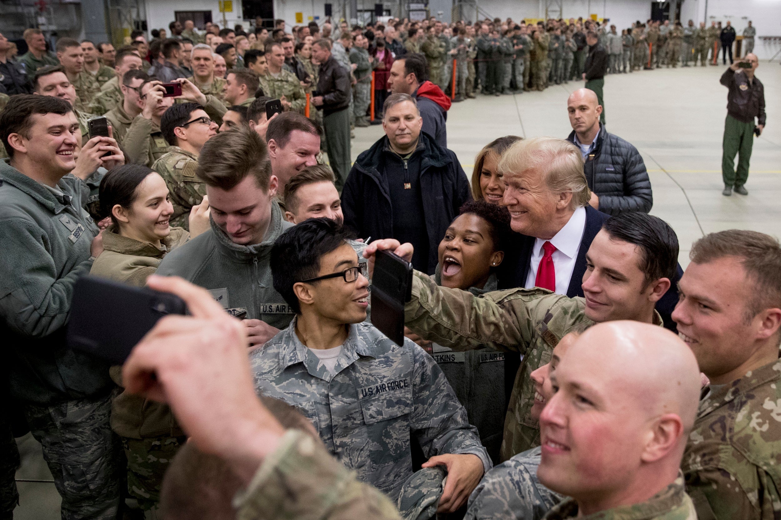 Trump and first lady Melania Trump greet members of the military at Ramstein Air Base, Germany