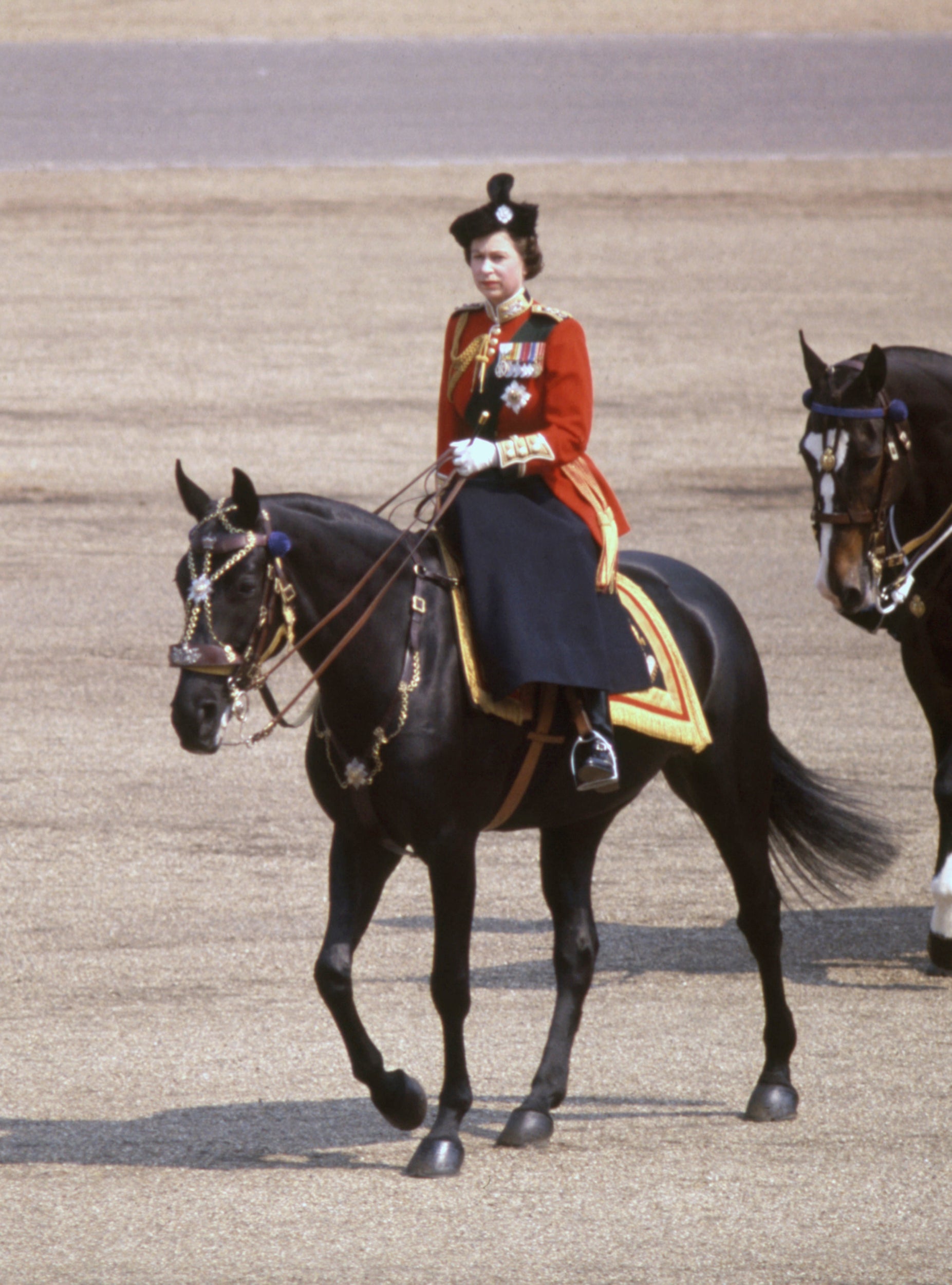 Queen Elizabeth II rides Burmese to inspect the 1st Battalion, Scots Guards, during the Trooping the Colour ceremony at Horse Guards Parade to mark the official birthday of The Queen, 16 June 1969