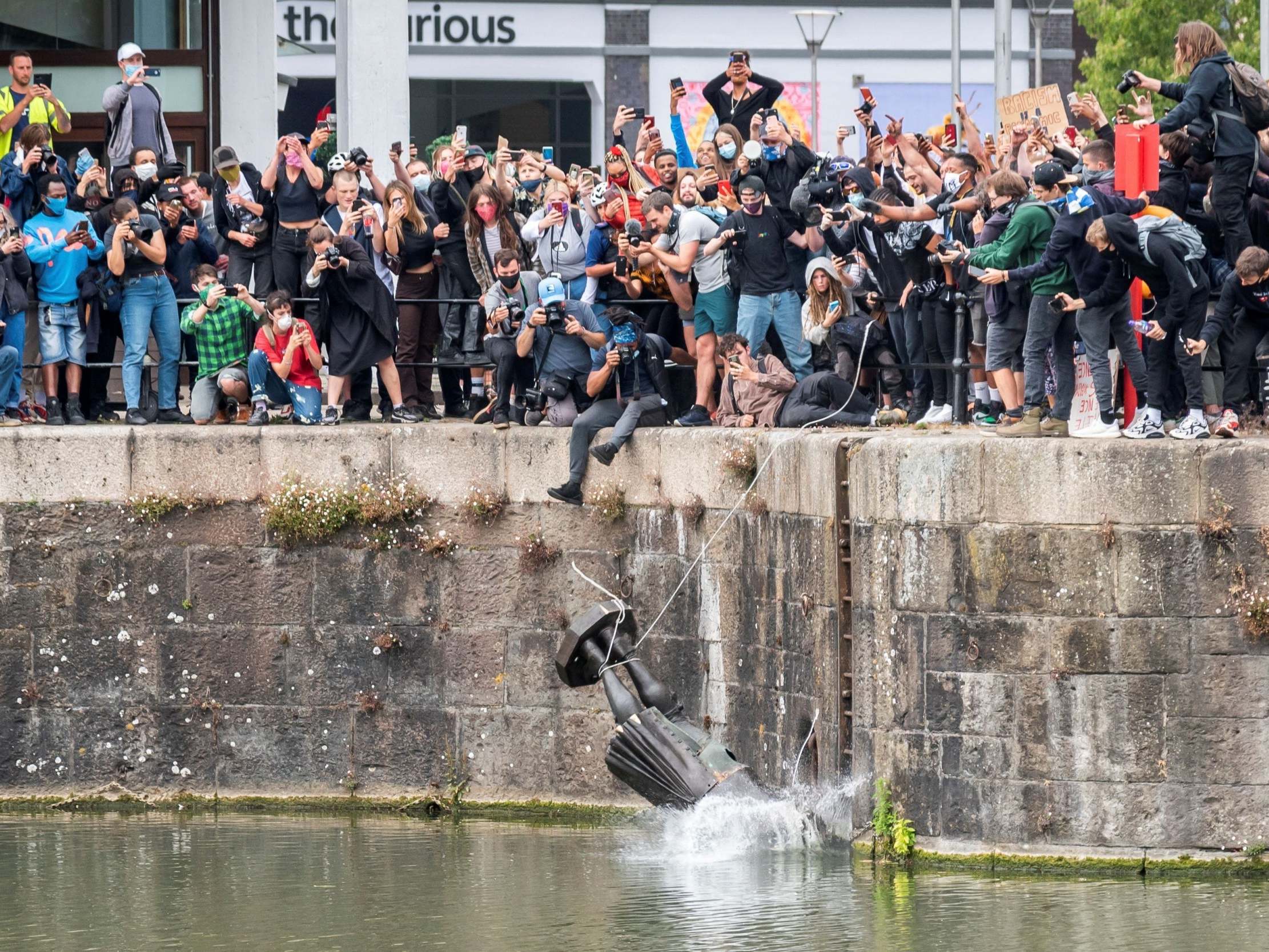 The statue is dumped into the Bristol Harbour on Sunday