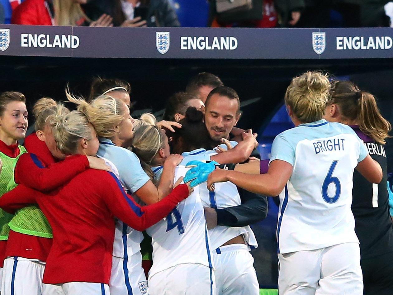 Nikita Parris celebrates with Mark Sampson