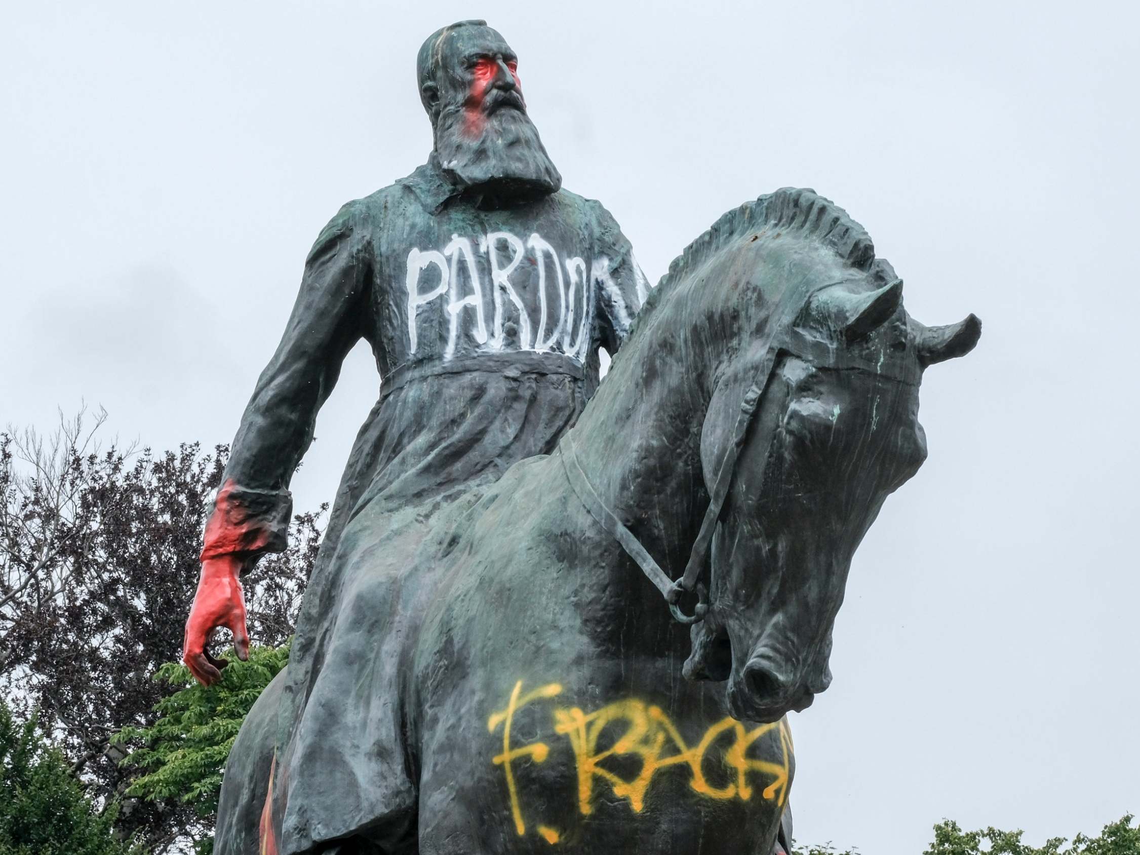 A statue of King Leopold II of Belgium daubed with graffiti in Brussels, Belgium