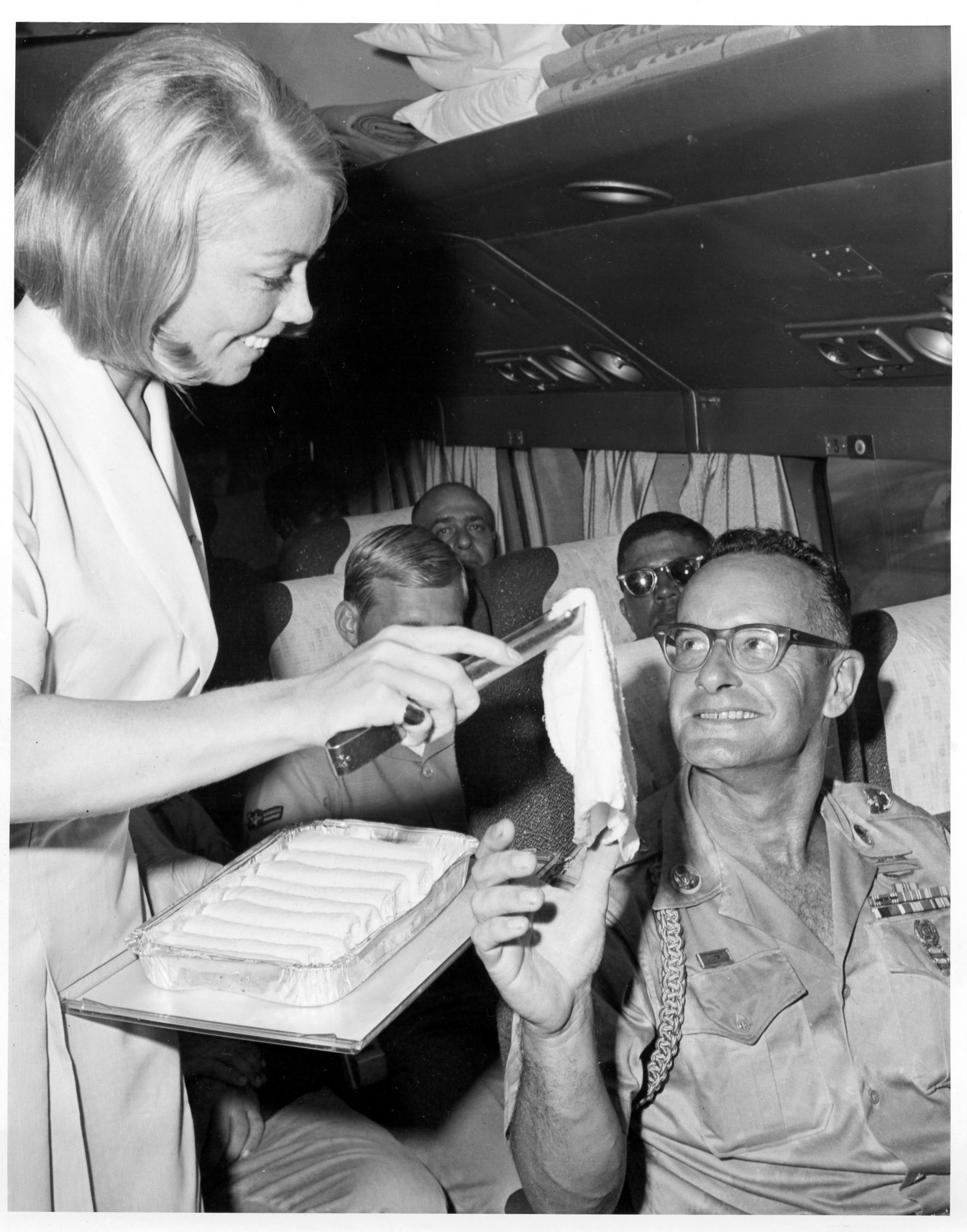 Isabel Dustman serves a towel to Sgt Robert Gear (Pan Am)