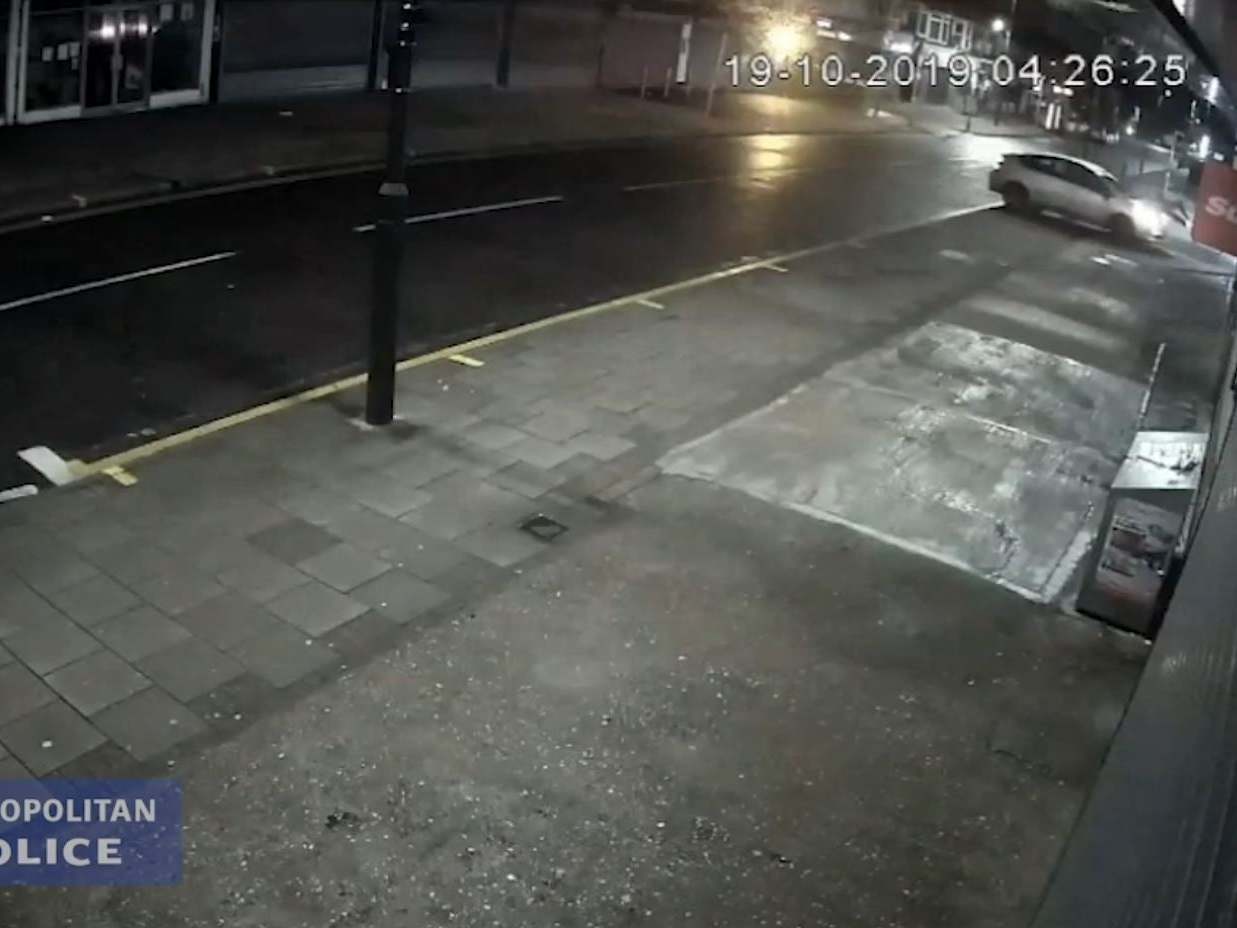 CCTV screengrab issued by the Metropolitan Police of Uran Nabiev's Toyota Prius driving towards a man on Bexley Road, in Erith, southeast London, 19 October 2020.