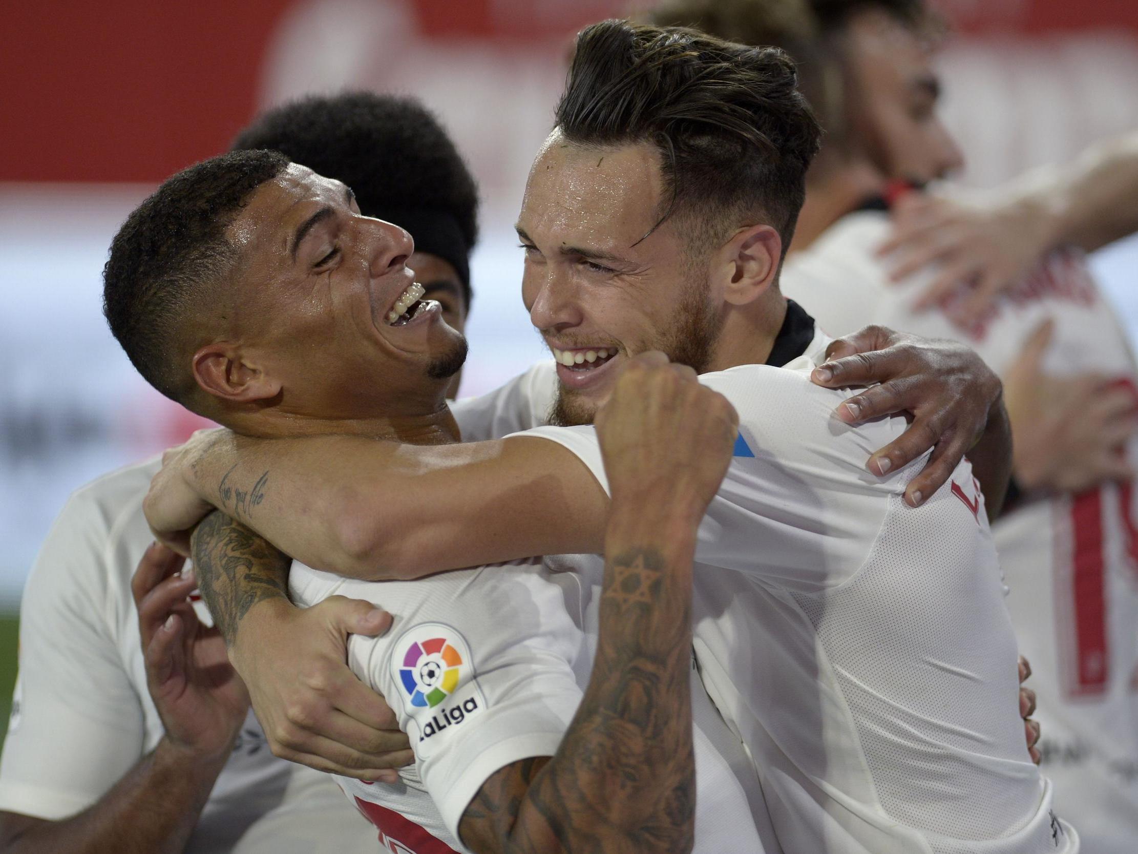 Ocampos celebrates with Diego Carlos in the Seville derby