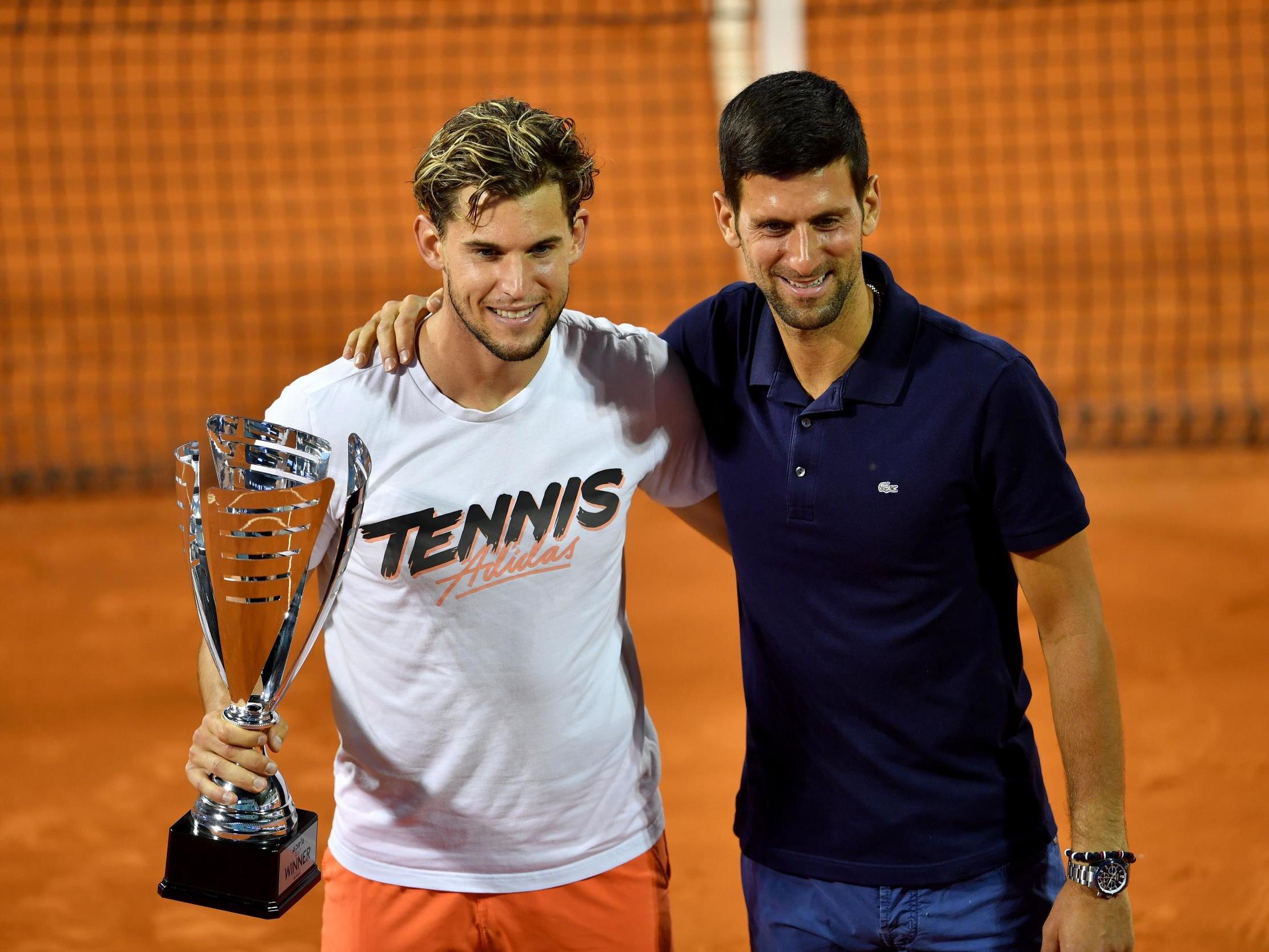 Dominic Thiem poses with Novak Djokovic after winning the Adria Tour final