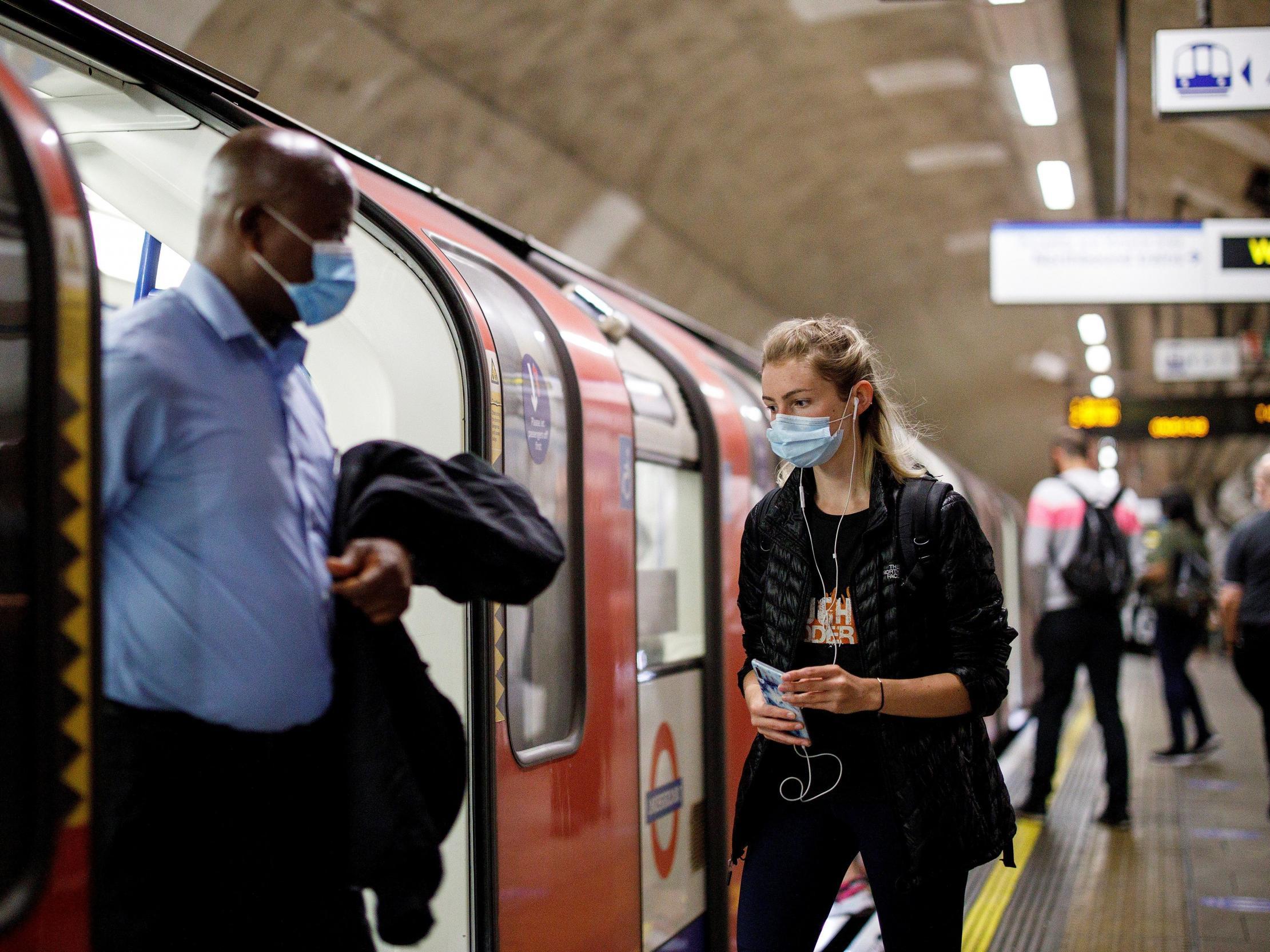 The law states that ‘no person may, without reasonable excuse, use a public transport service without wearing a face covering’ (AFP via Getty Images)