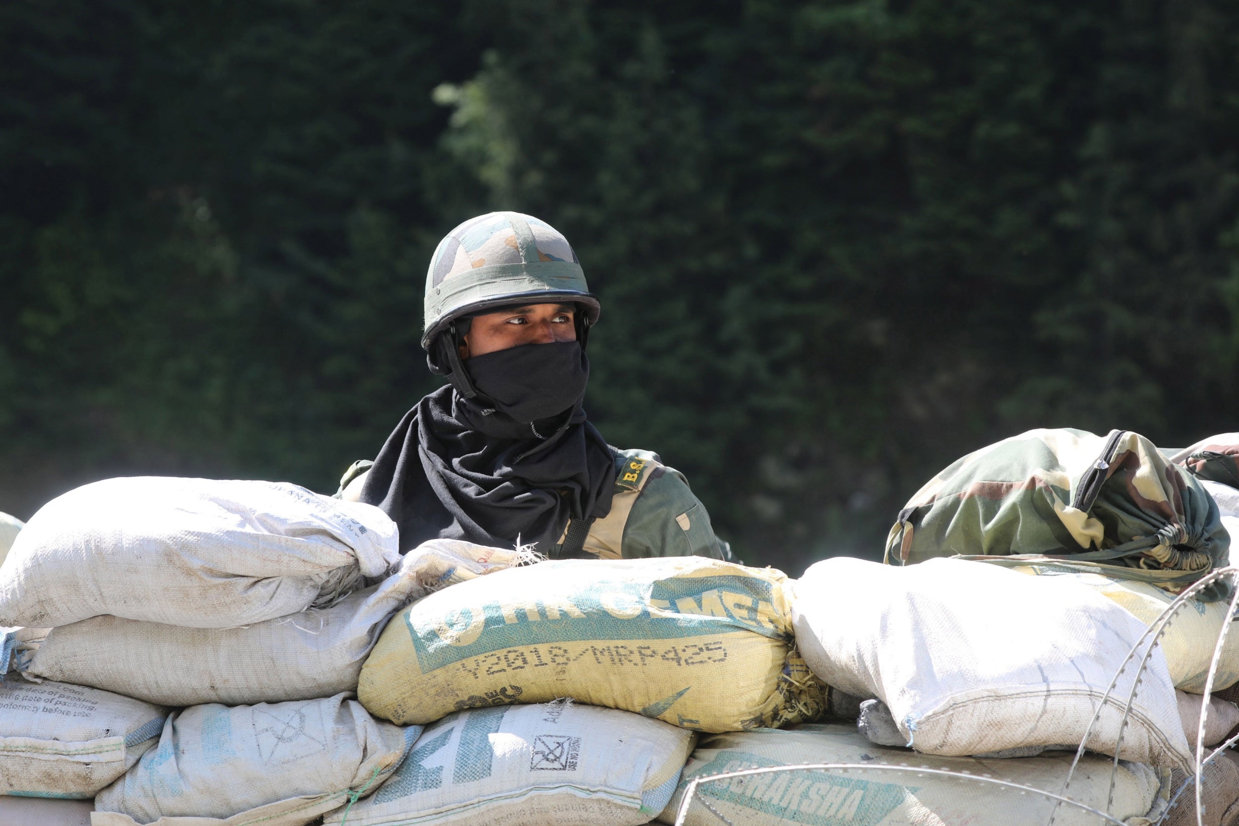 An Indian soldier stands guard at check post along a highway leading to Ladakh, on Wednesday 17 June