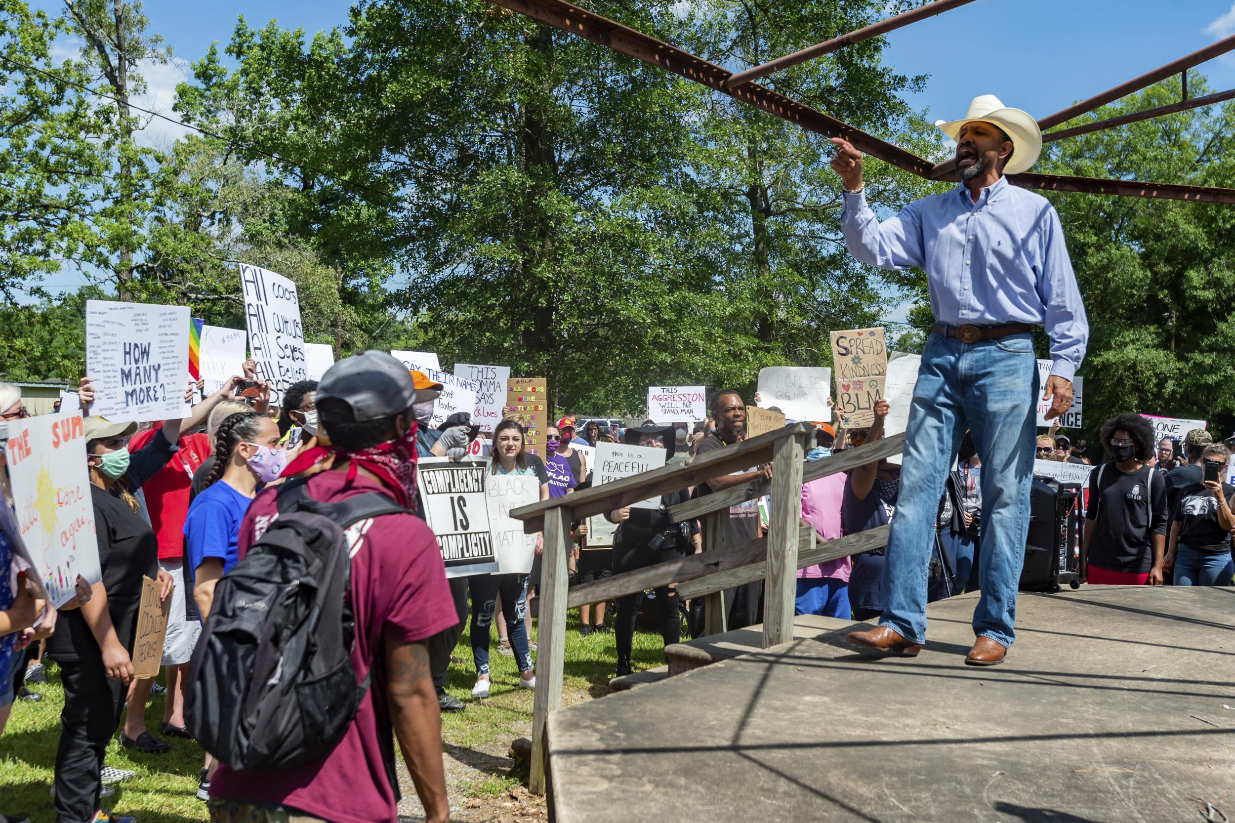 Michael Cooper speaks to those assembled in Gould Park (Fran Ruchalski/The Beaumont Enterprise/AP)