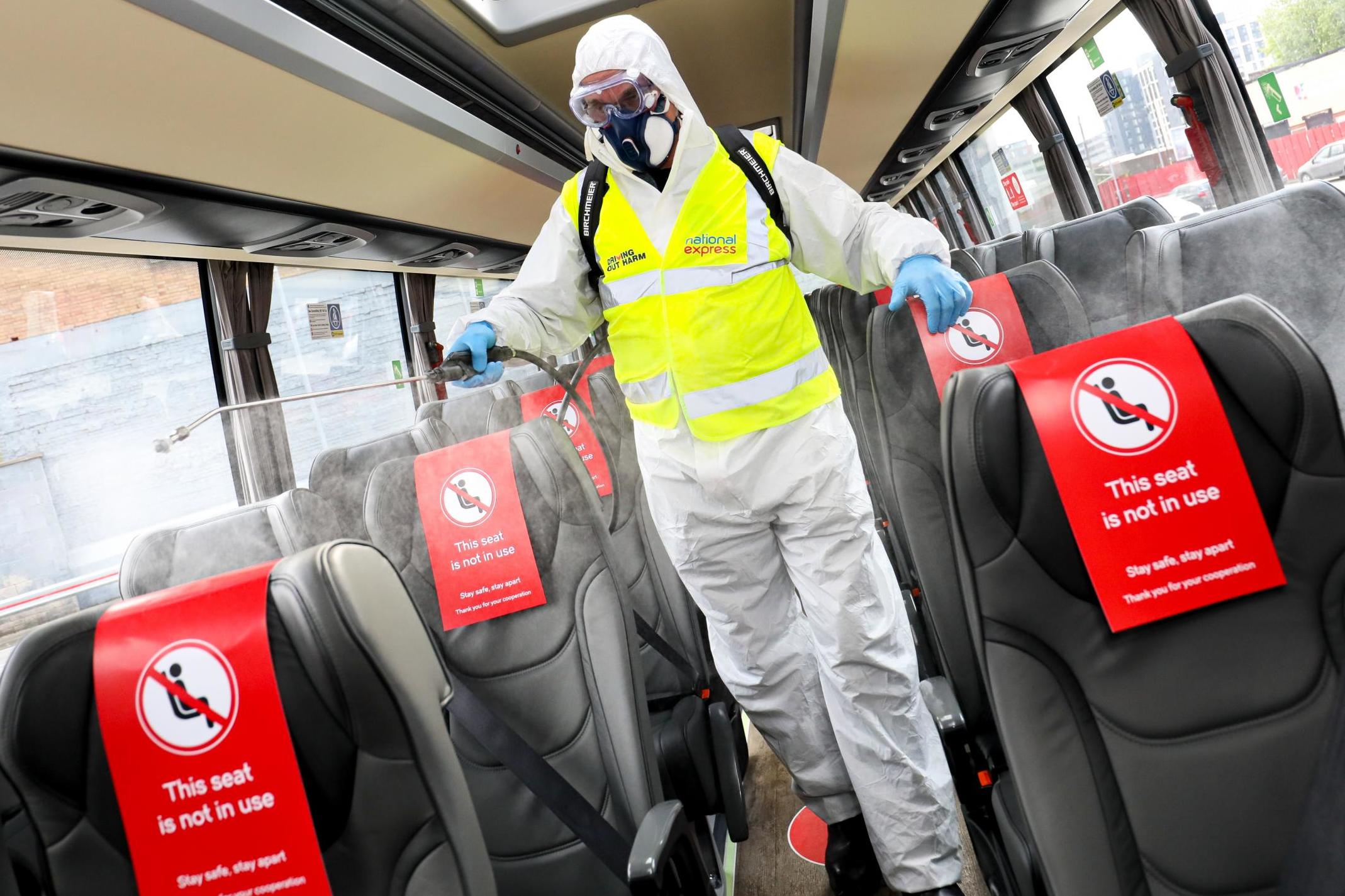 New normal: 'fogging' anti-viral treatment on a National Express coach