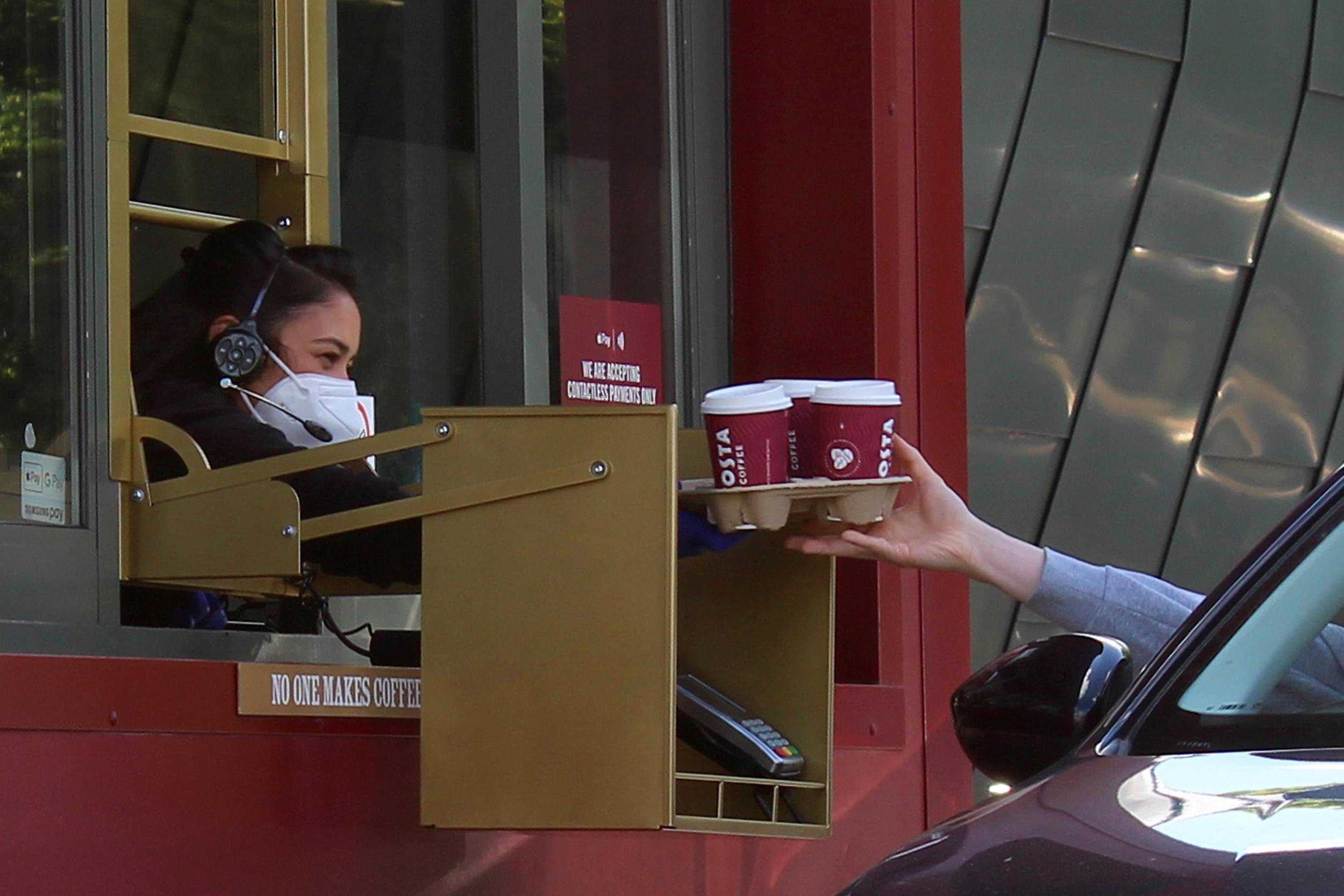 Drive-through lanes will also open and customers will pick up their orders through serving hatches to limit contact (Getty)