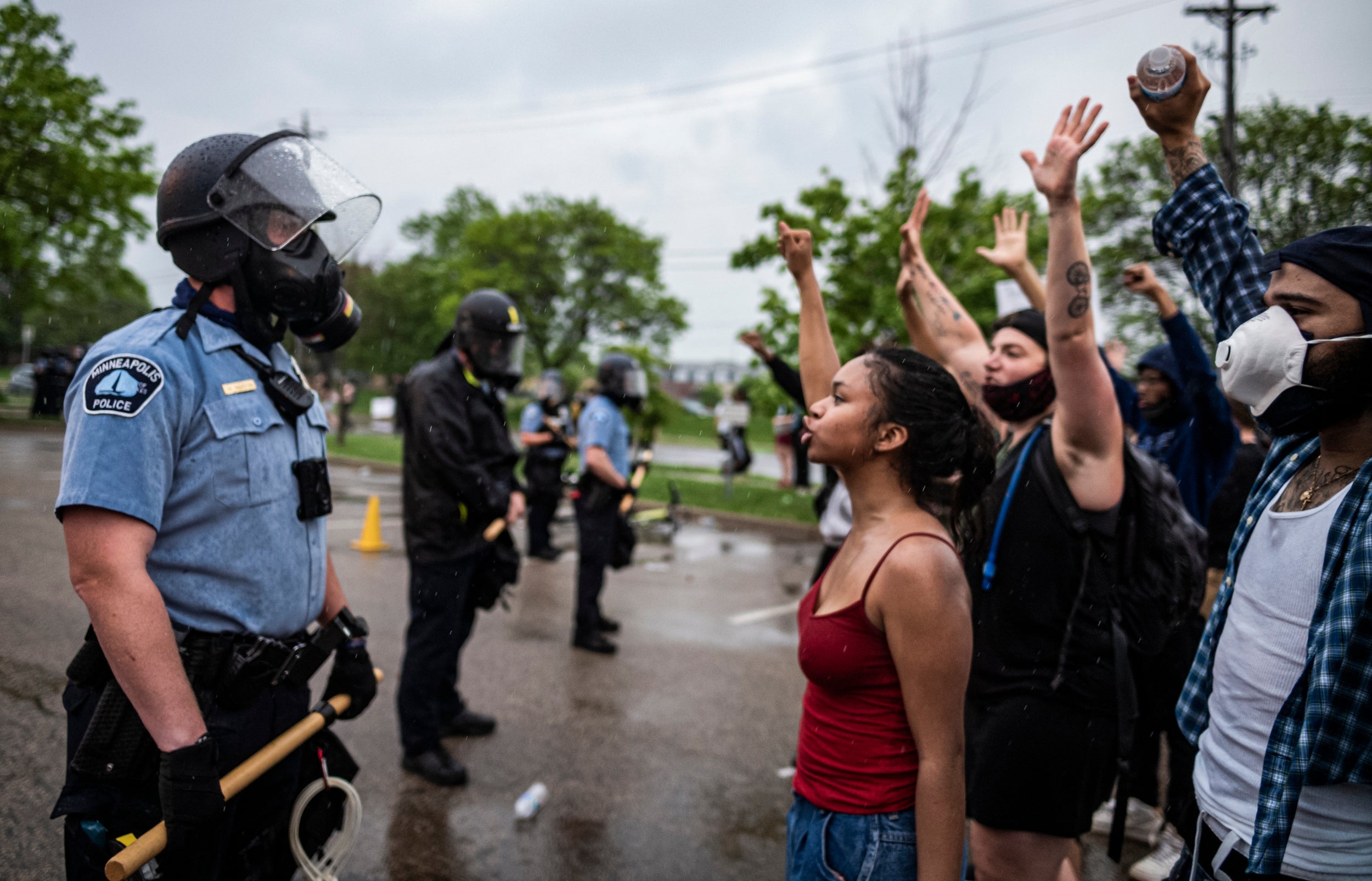 Police confront protesters during a rally for George Floyd in Minneapolis