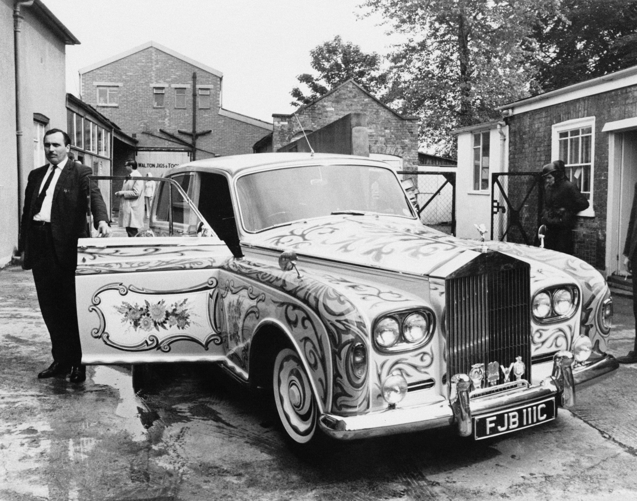 Anthony stands next to John Lennon's custom-built Rolls-Royce Phantom V in 1967