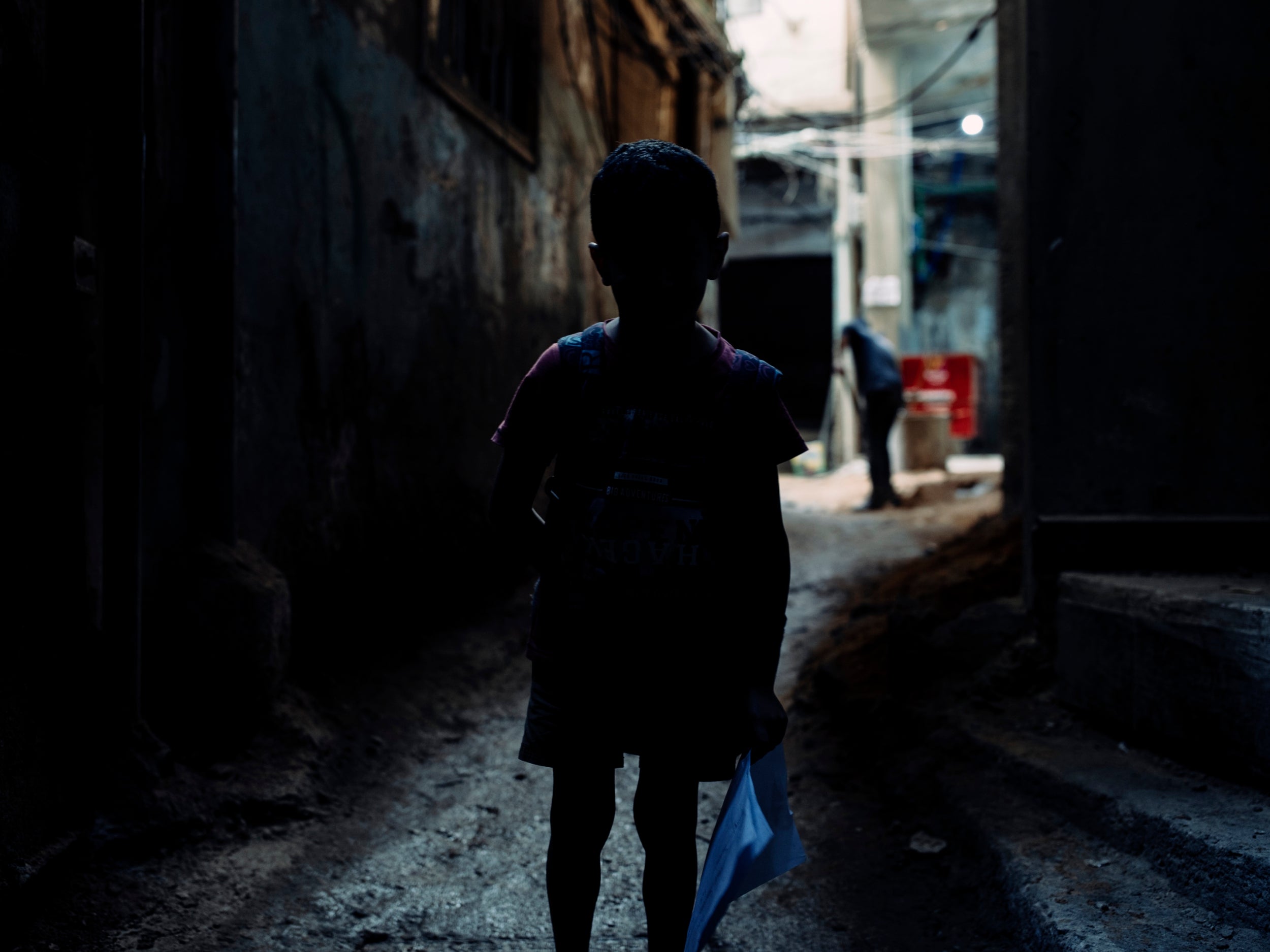 A child refugee stands in an alleyway of the Bourj al-Barajneh Camp, Beirut