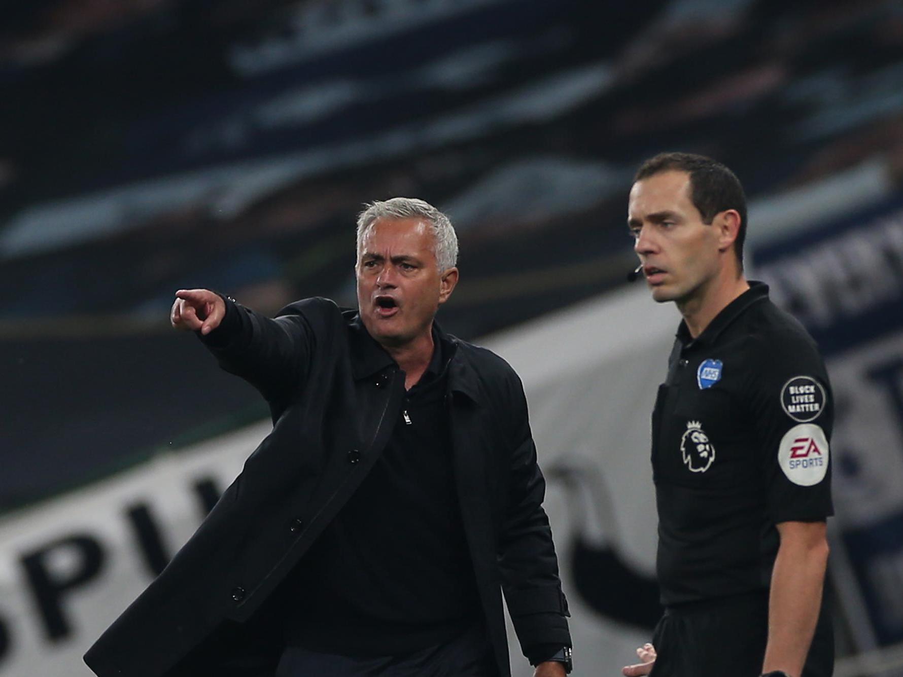 Mourinho protests to the assistant referee on the touchline