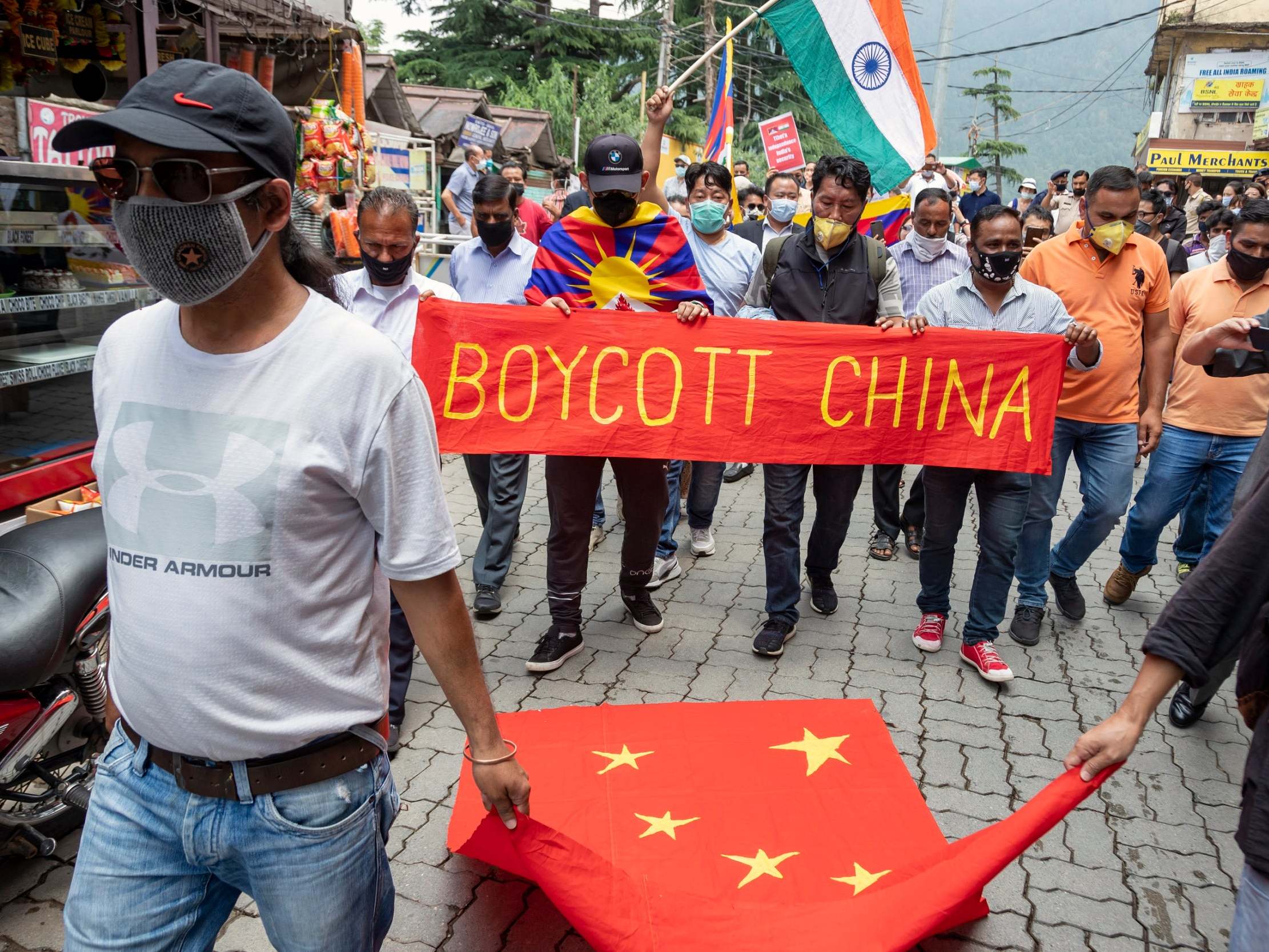 Exile Tibetans and local Indians participate in a protest against the Chinese government in Dharmsala