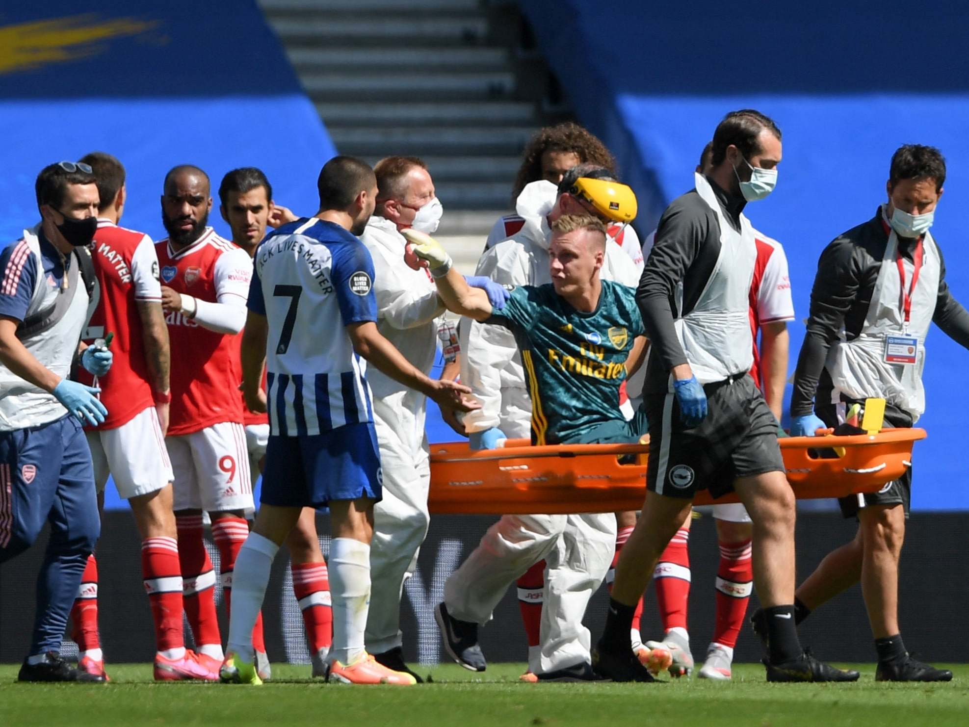 Bernd Leno confronts Neal Maupay as he leaves the field