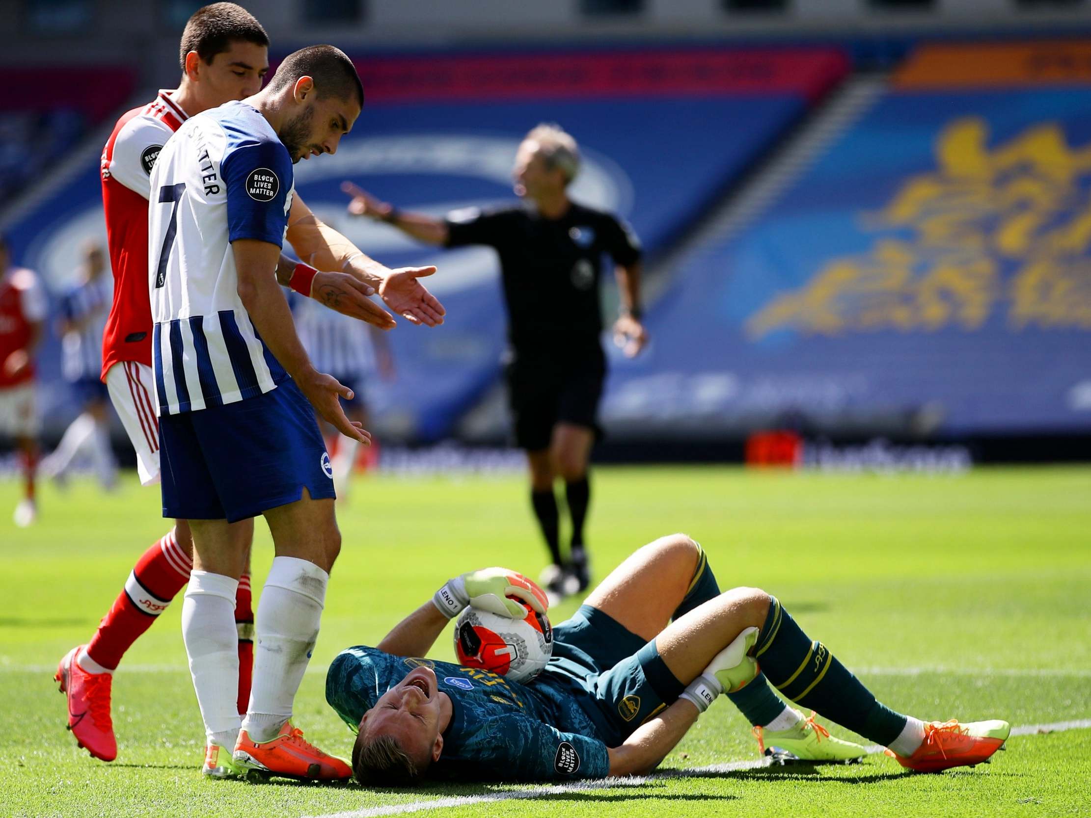 Bernd Leno lies injured on the ground after the incident