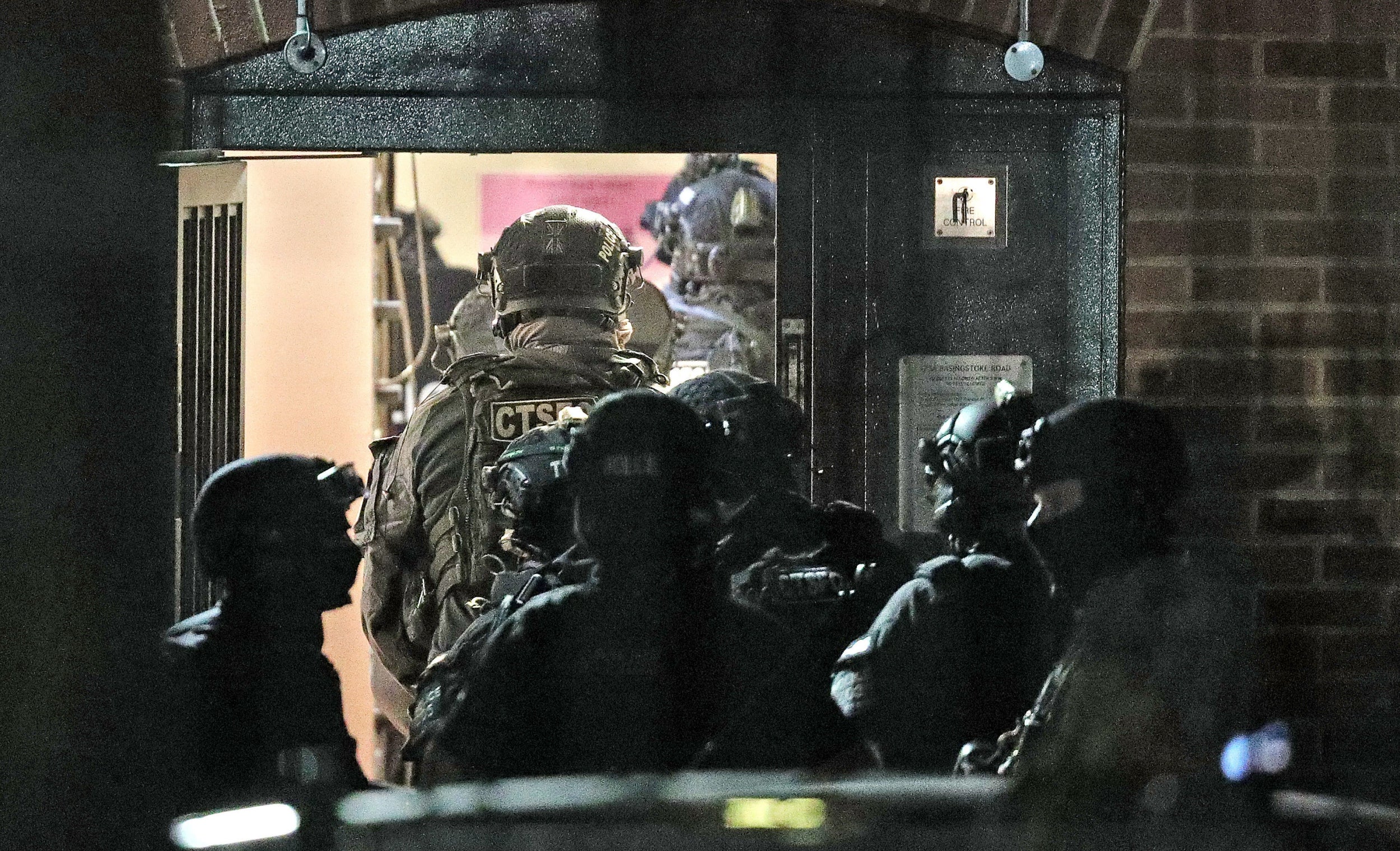 Armed police officers at a block of flats off the Basingstoke Road in Reading