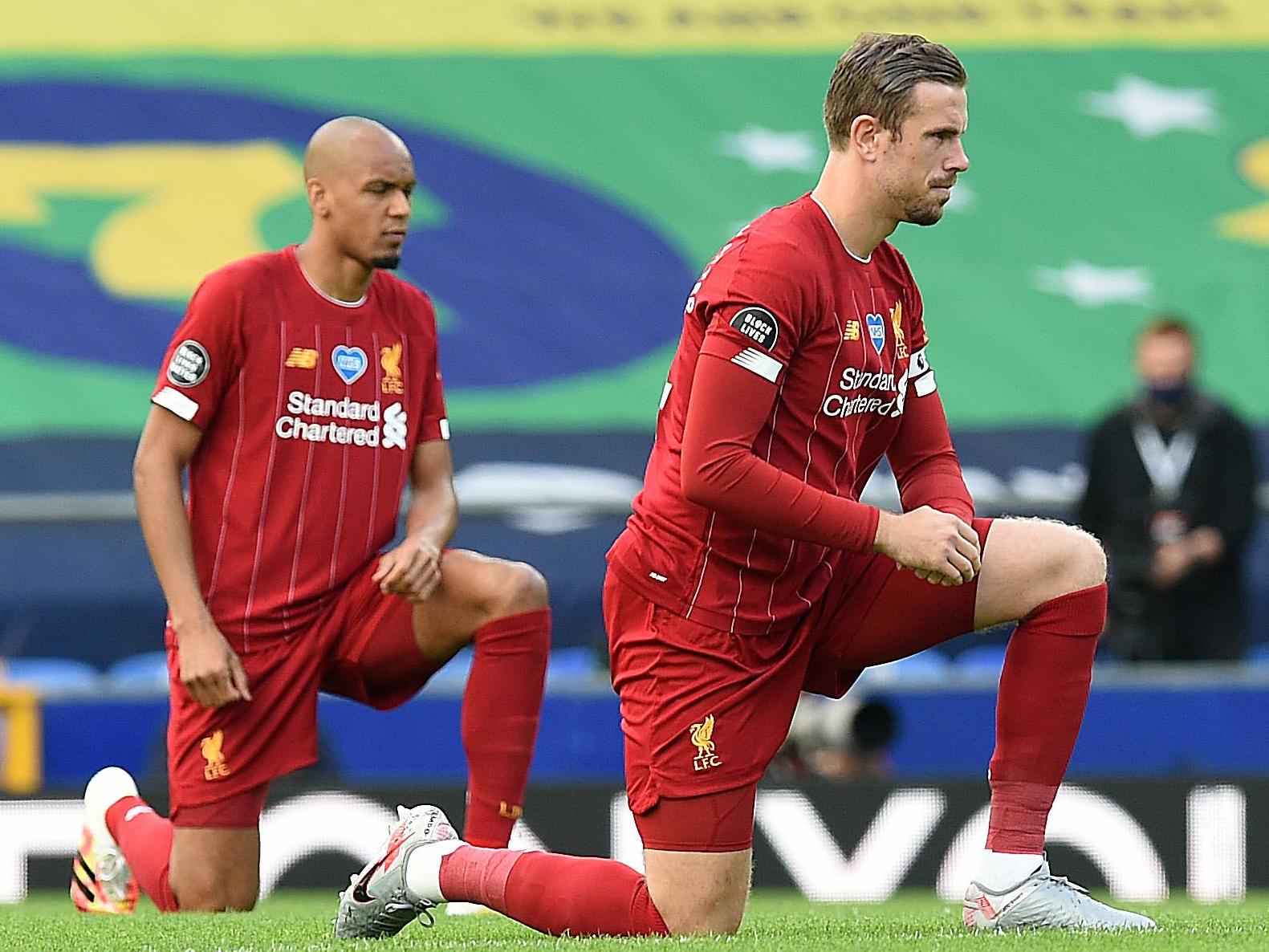 Fabinho (left) and Liverpool captain Jordan Henderson