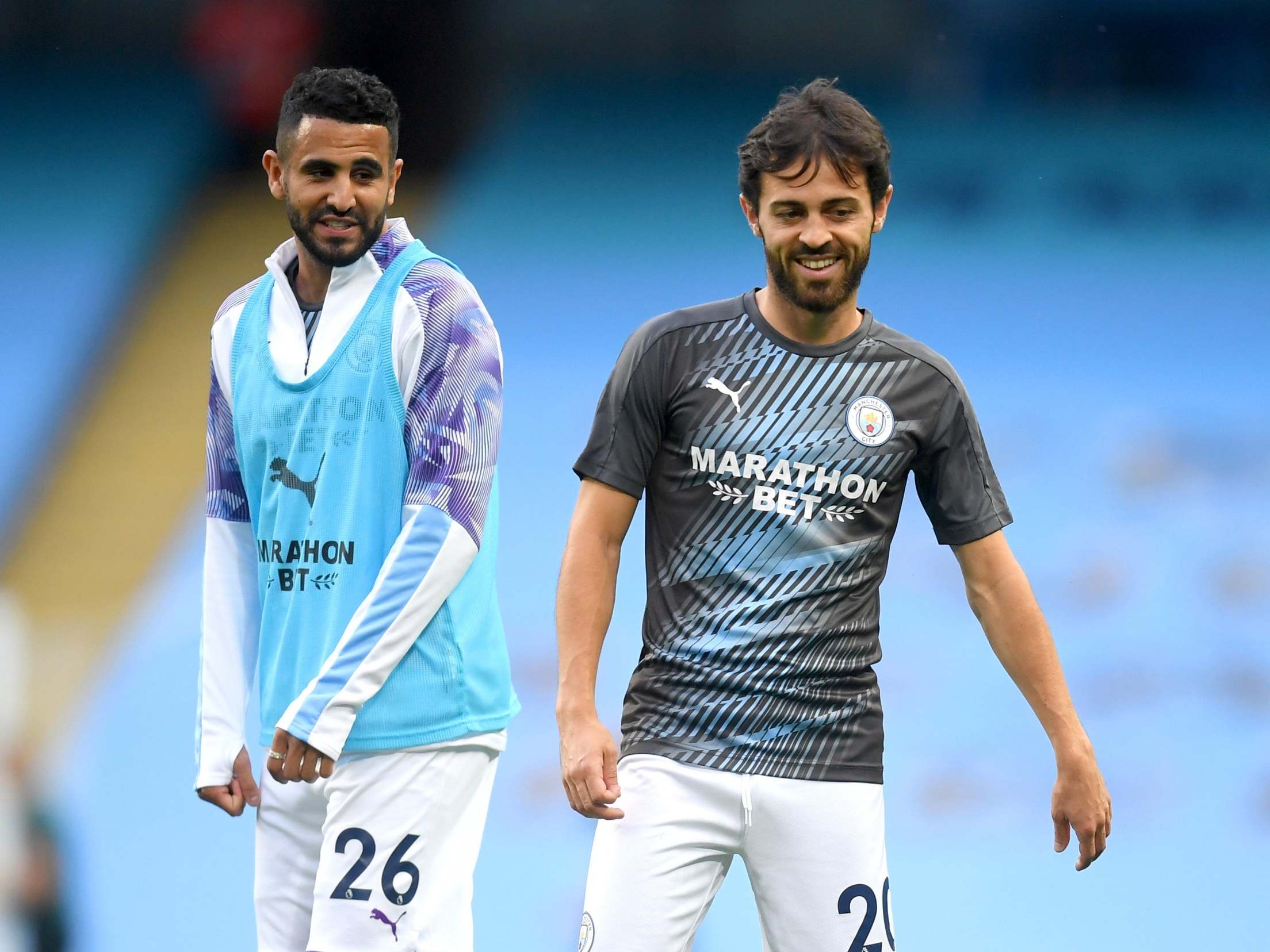 Riyad Mahrez and Bernardo Silva warm up