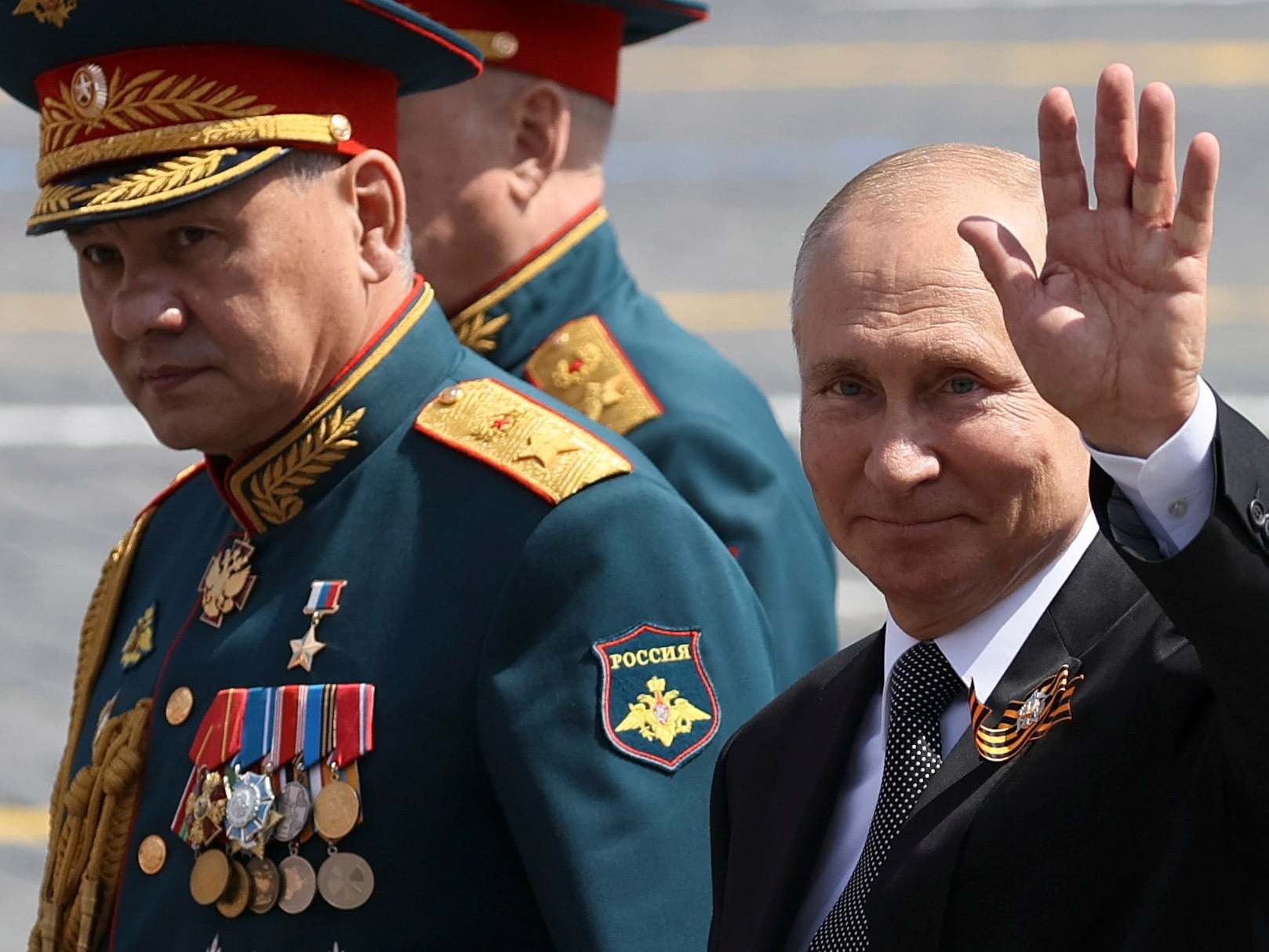 Putin and defence minister Sergei Shoigu leave Red Square after the military parade