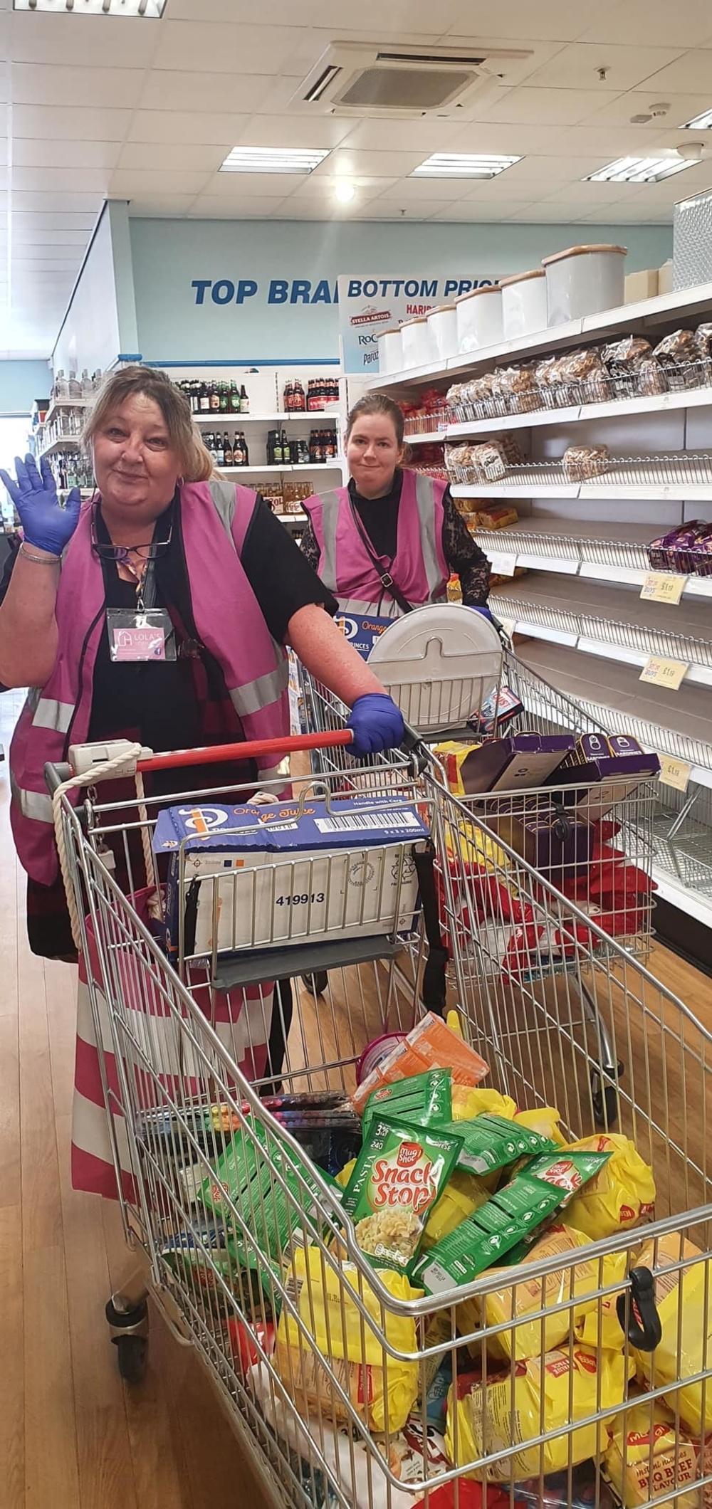 Lorraine Anne (left) shopping for goods to donate to east London’s homeless