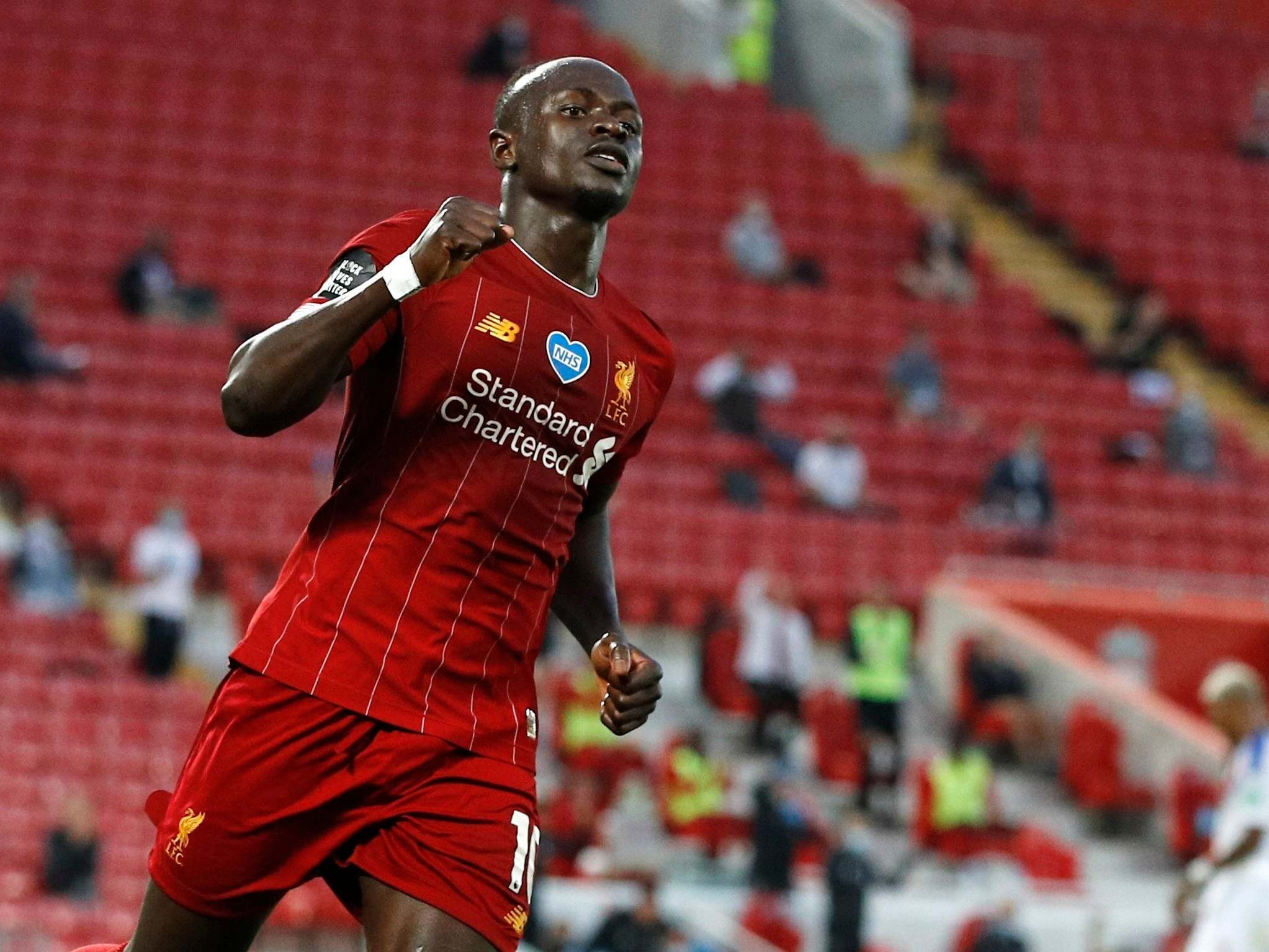 Sadio Mane celebrates scoring Liverpool’s fourth