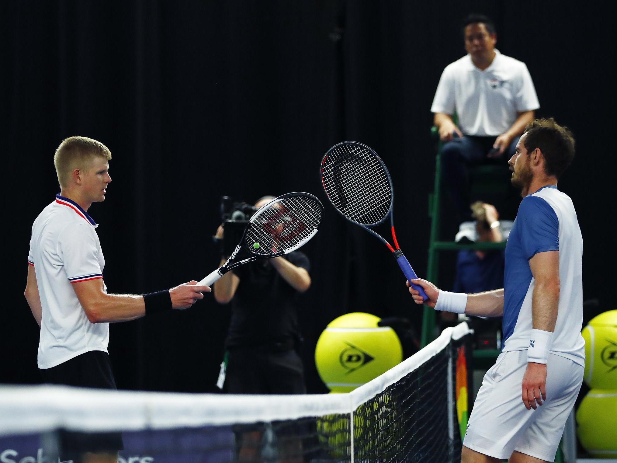 Murray and Edmund embrace after their match