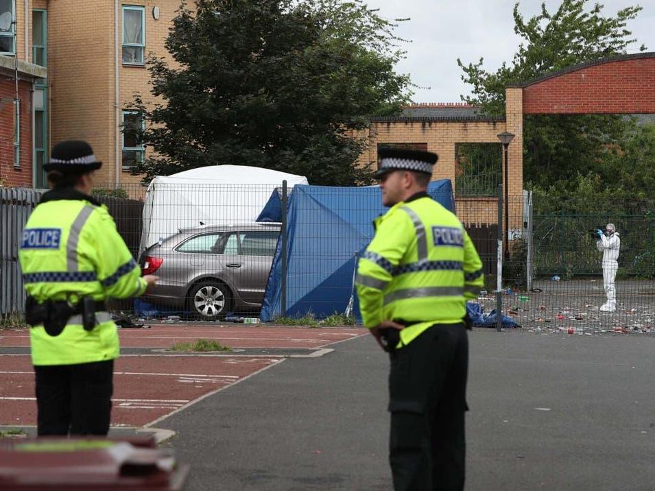 Police at the murder scene in Manchester