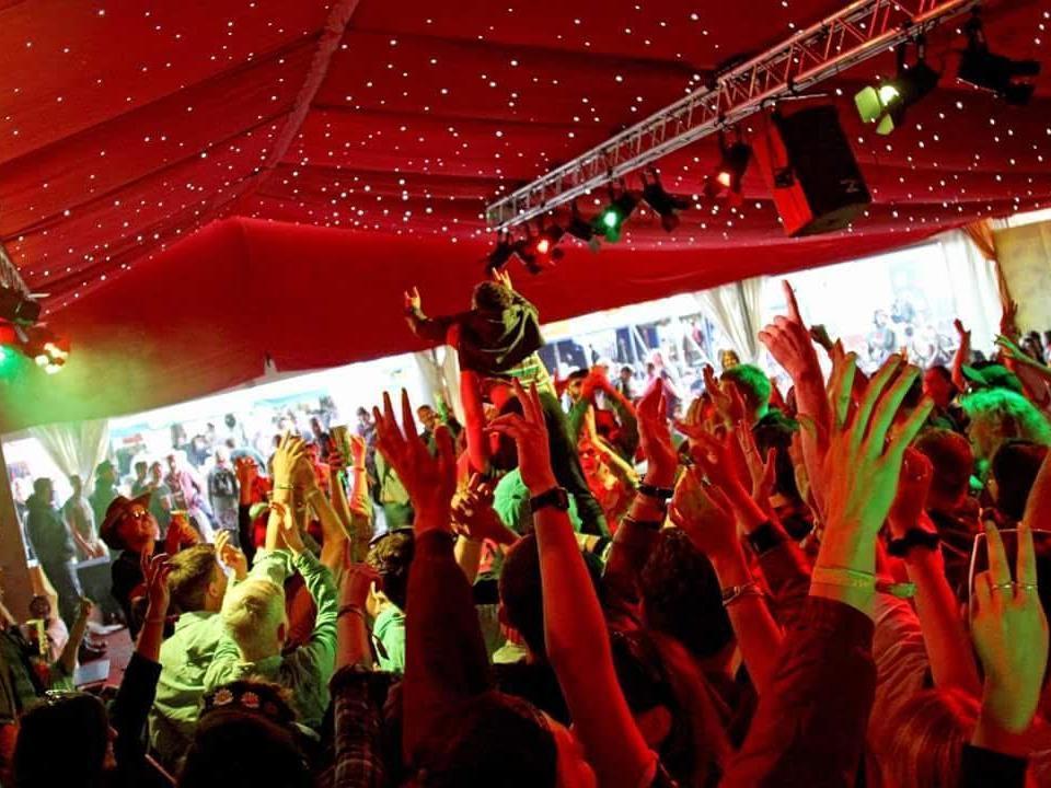 The crowd vault photographer Dafydd Prodger's son Evan into air during the 2015 edition of Glastonbury