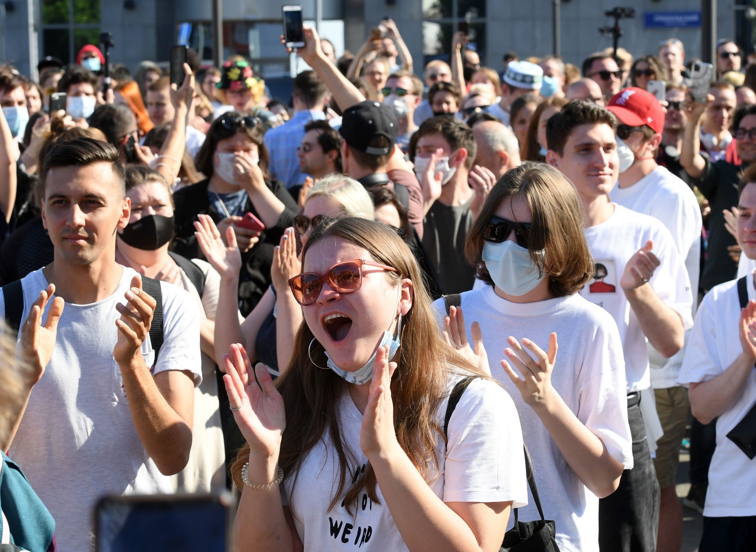 Those outside court in Moscow react after the announcement of the verdict on Friday