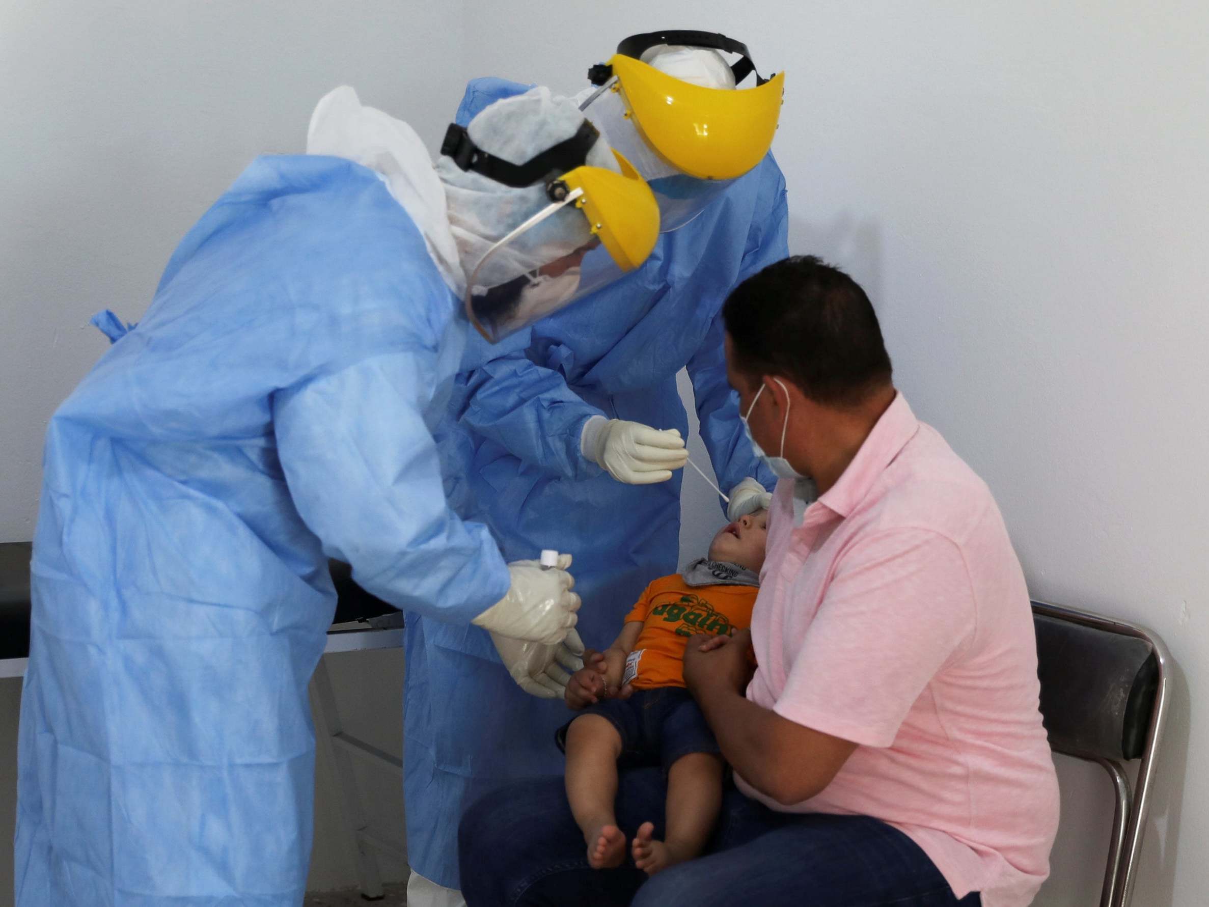 A medical team takes a swab from a child to test for coronavirus at a medical clinic in Tripoli, Libya (Reuters)