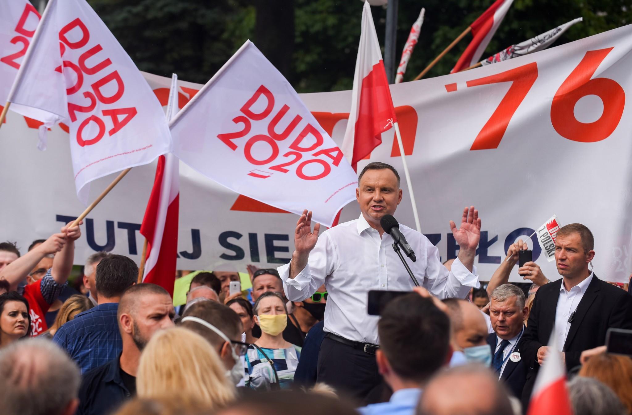 Andrzej Duda delivers a speech for supporters during a campaign rally before Sunday’s presidential election