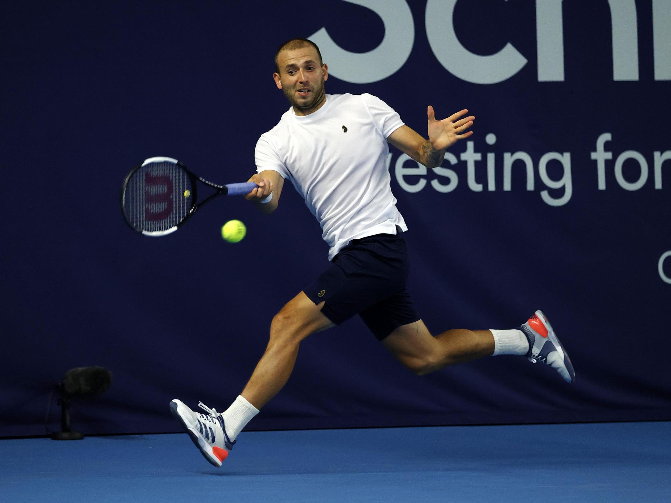 Evans hits a forehand on the run