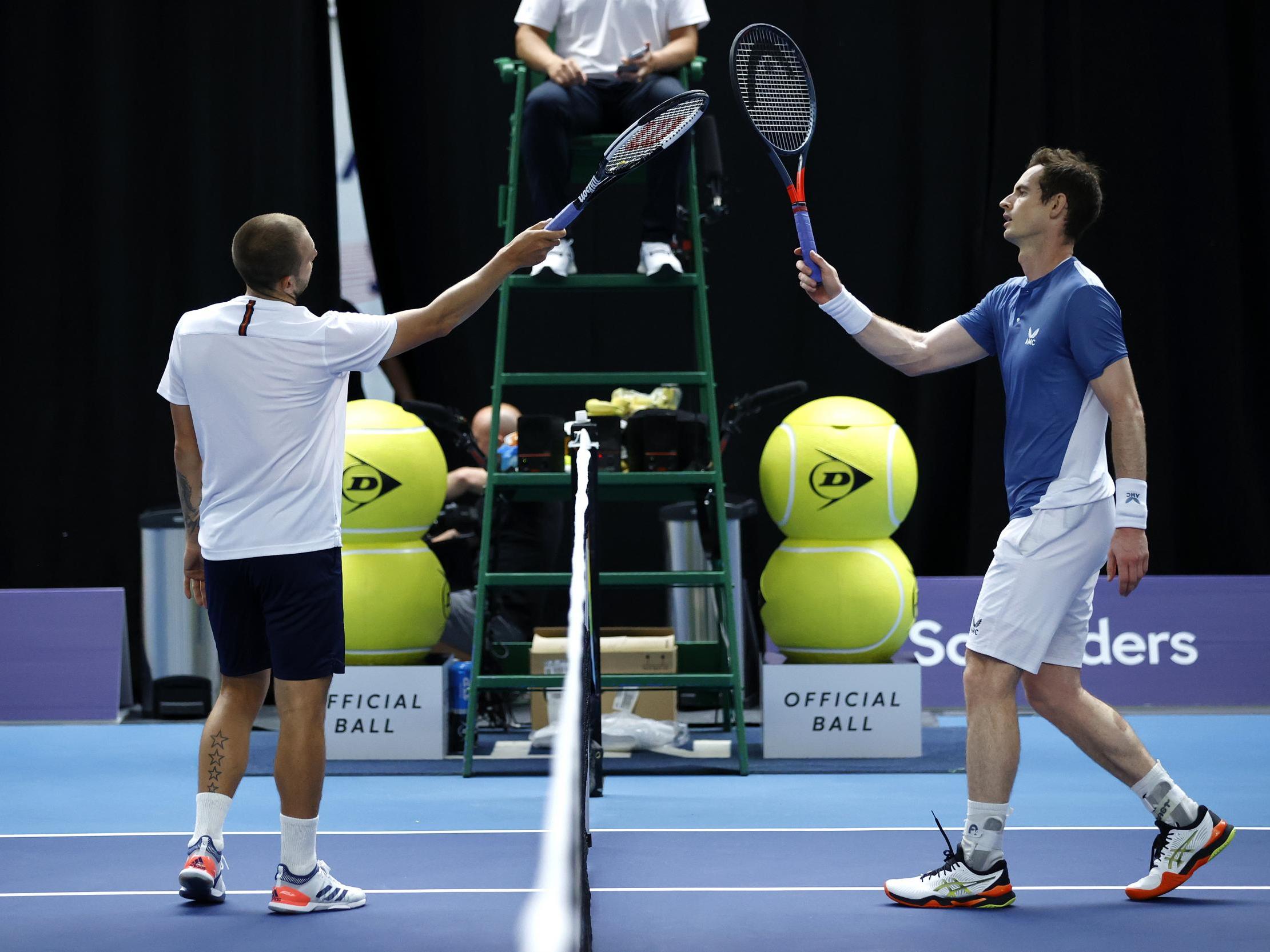 Evans and Murray embrace after their match