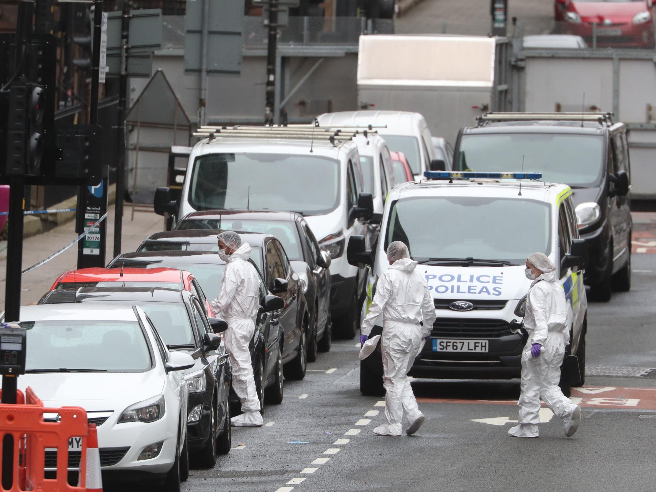 Police forensic officers at the scene in West George Street, Glasgow