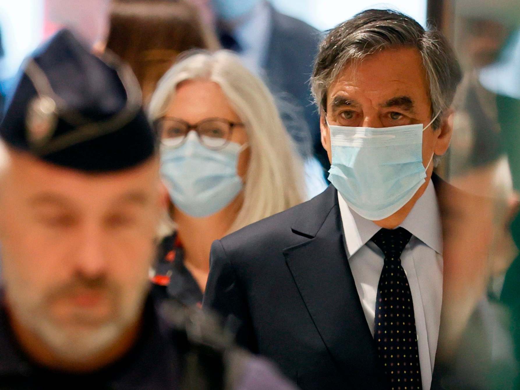 Former French Prime minister Francois Fillon and his wife Penelope Fillon arrive at the Paris' courthouse