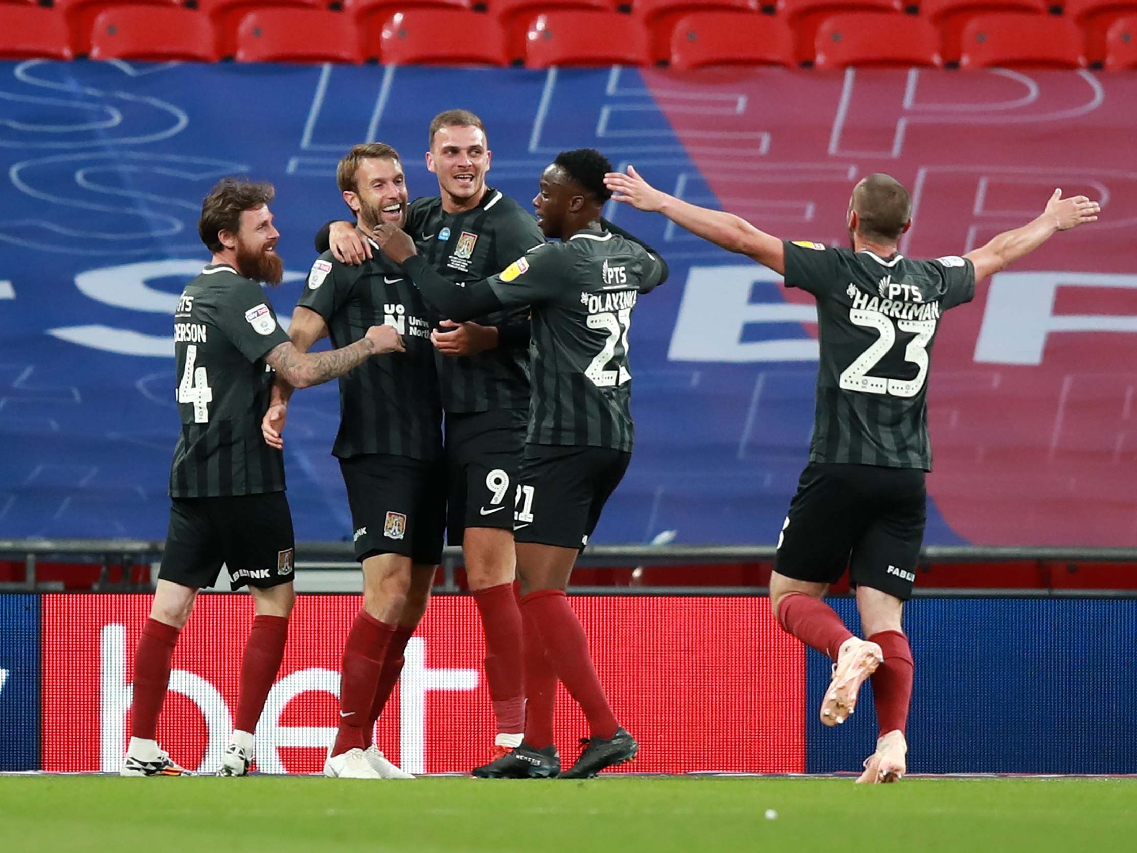 Northampton Town celebrate Andy Williams' adding a fourth goal