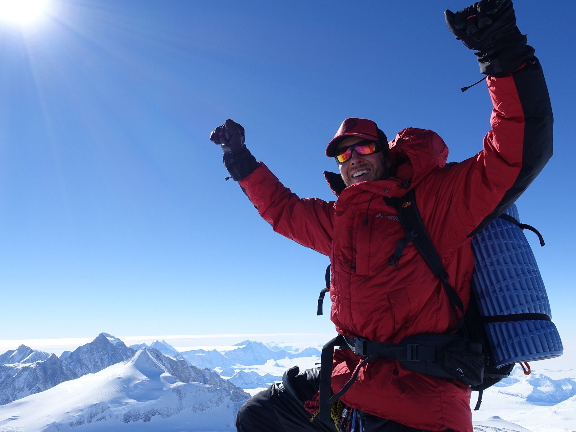 Daniel Bull celebrates completing the Seven Summits at neighbouring Mount Vinson in Antarctica