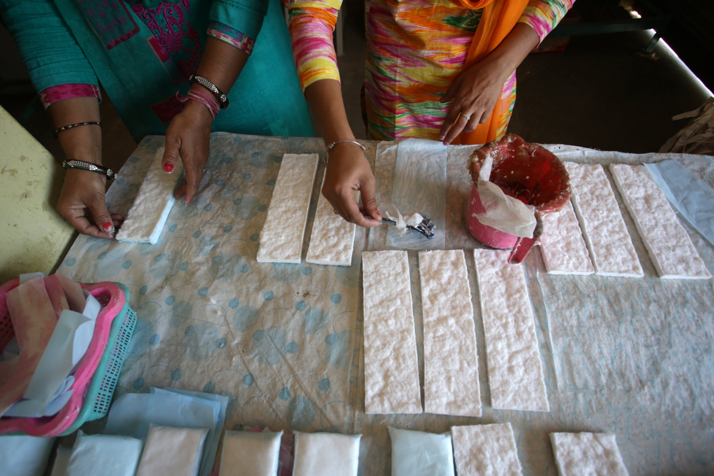 A self-help group has set up their own sanitary napkins unit, making low-cost sanitary pads for rural women