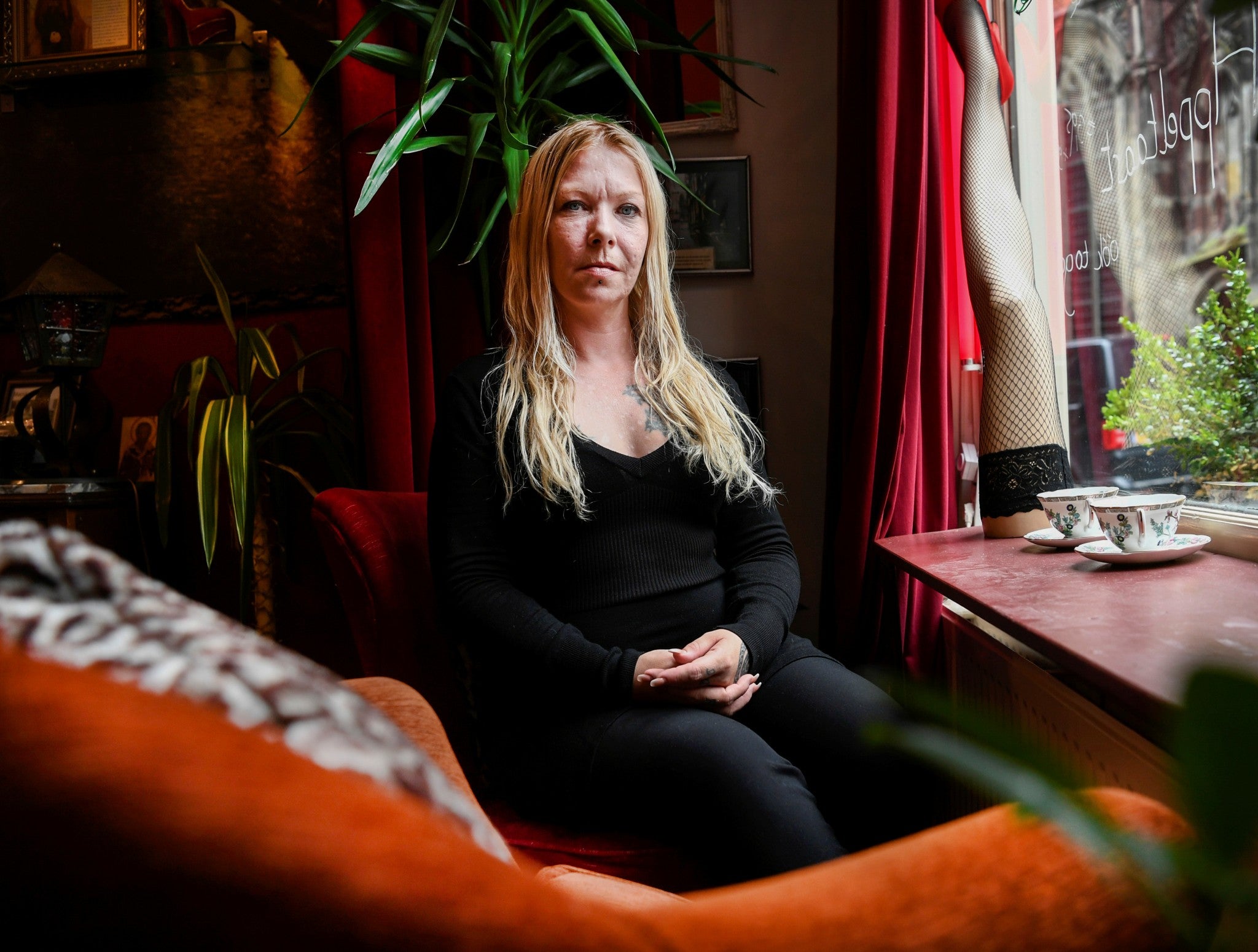 Sex worker Foxxy poses in the Prostitution Information Centre in Amsterdam, Netherlands