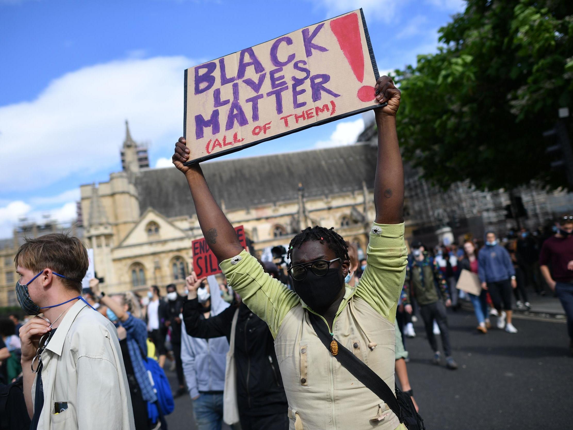 Activists demonstrate during a Black Lives Matter protest in Parliament Square in central London last month